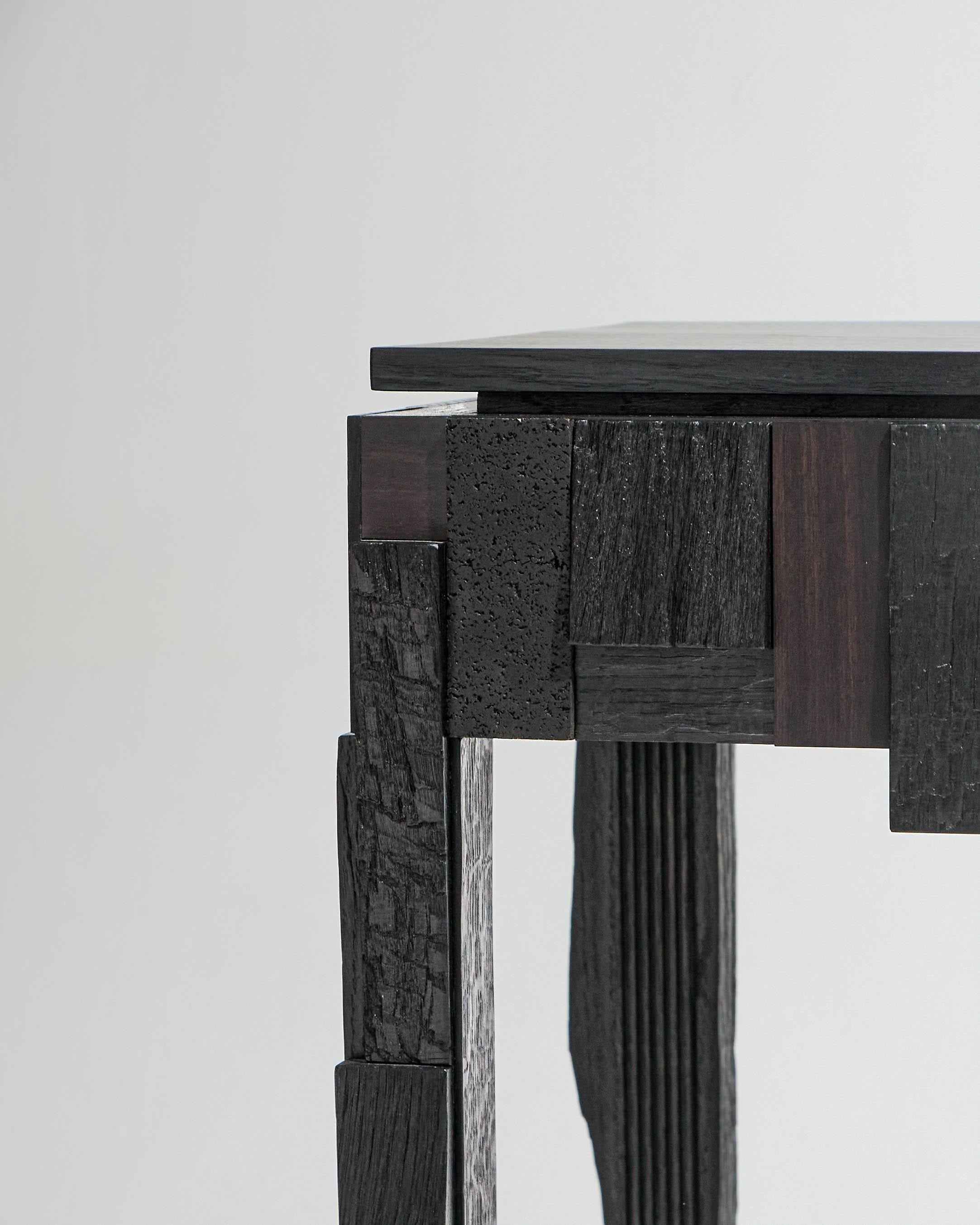 Three-drawer console in black wood by designer Julien Hardy. Unique piece.
Crafted from oak, bog oak, cork oak, Mozambique ebony, and purpleheart, with hand-cut dovetail joints.
This piece was exhibited at the 2025 Révélations Biennial at the Grand