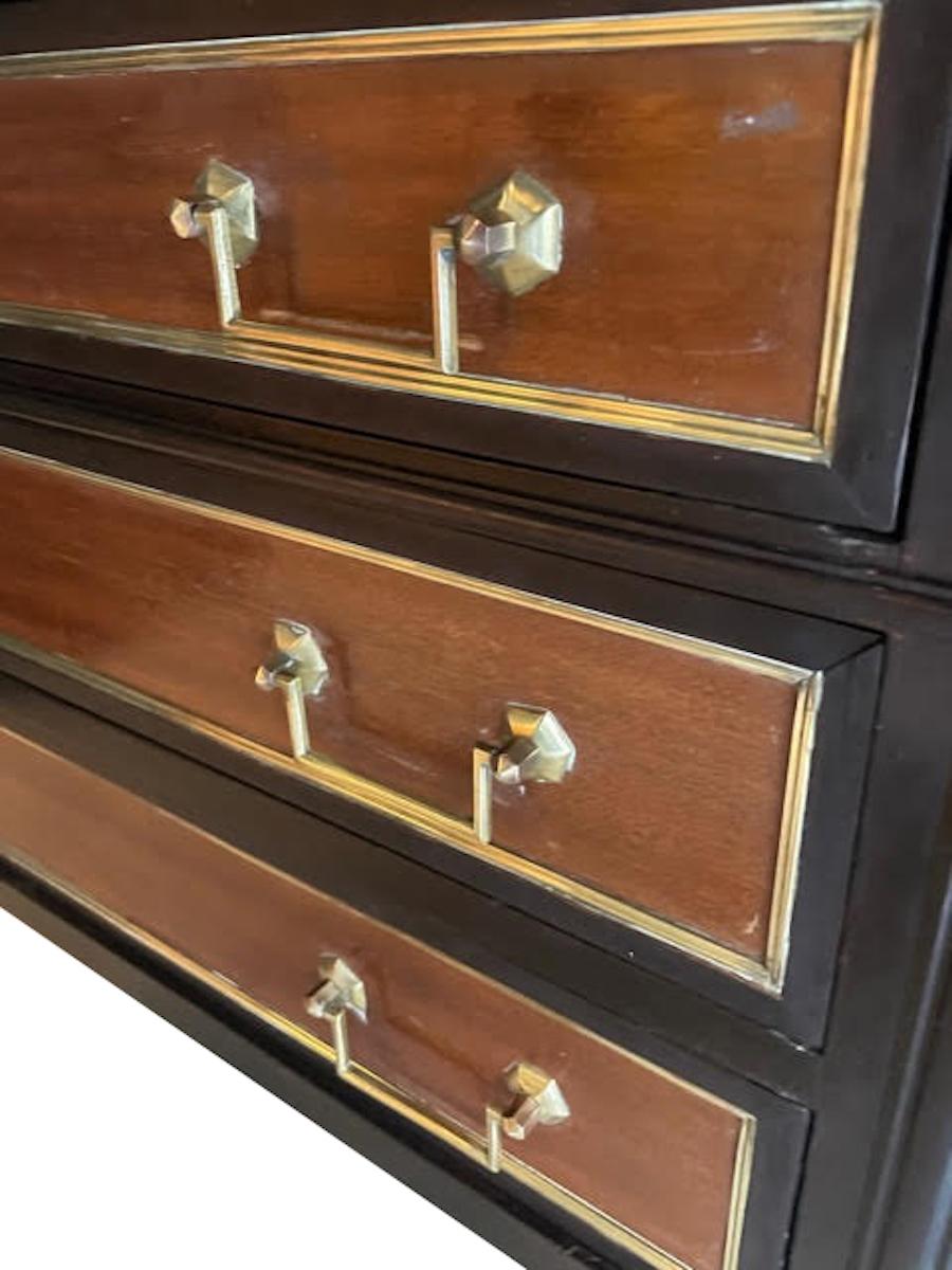 1980's French three drawer commode in the style of French Empire.
Natural color elm wood drawers with ebonized frame with fluted leg details.
Marble top
Bronze hardware and sabots.
 