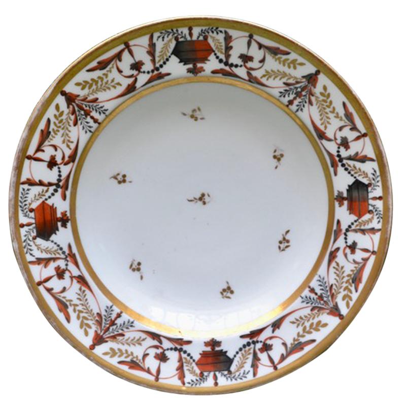 A set of three rare early 19 Century porcelain plates all  in orange red gold and white hues.  The plate shown on the left is a Chamberlains Worcestor, the middle plate is a Coalport and the plate on the right is Paris Porcelain. There is a tiny