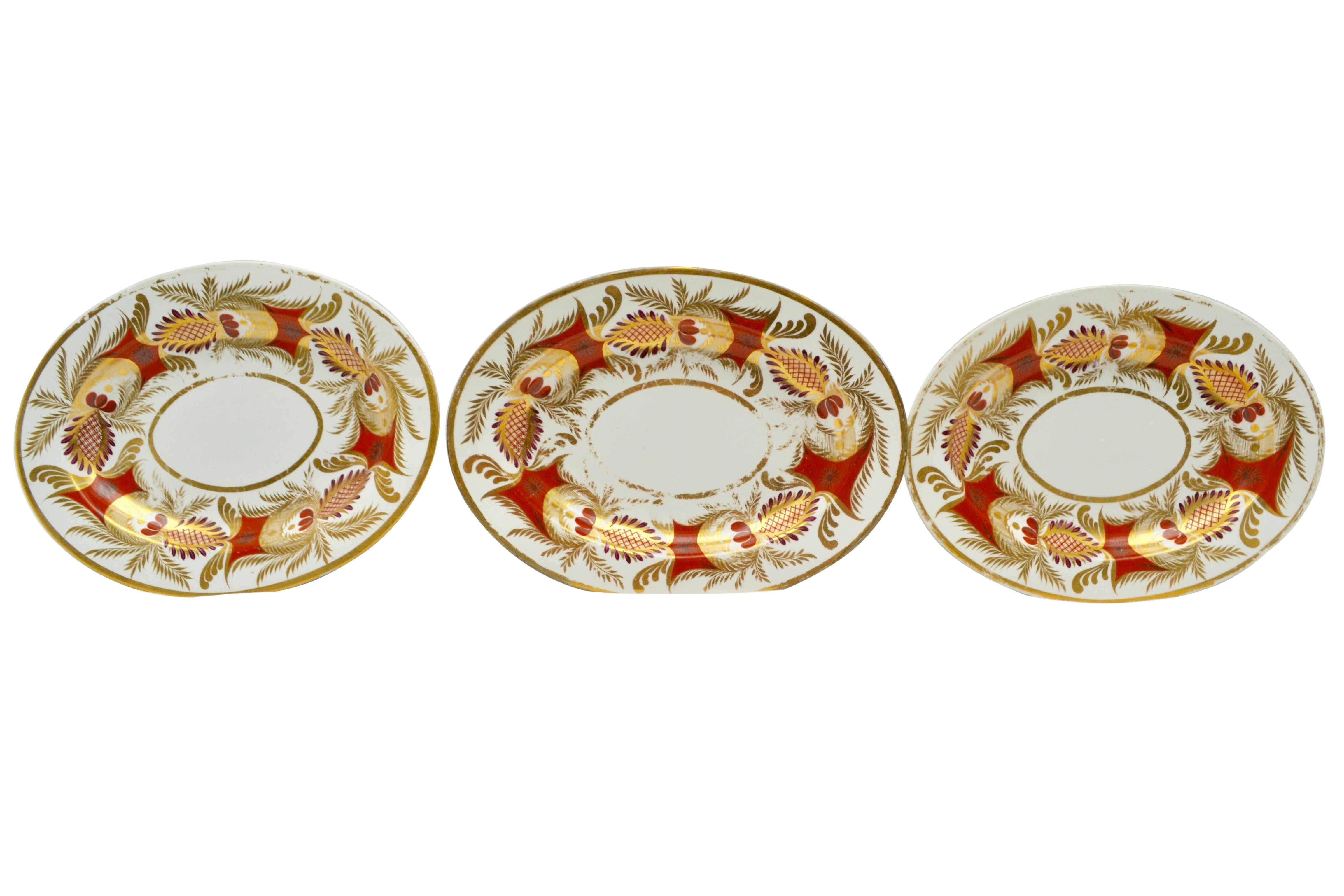 A set of three Coalport oval serving platters in coral gold and white. Some rubbing of the gilding but there are no cracks, chips or repairs.