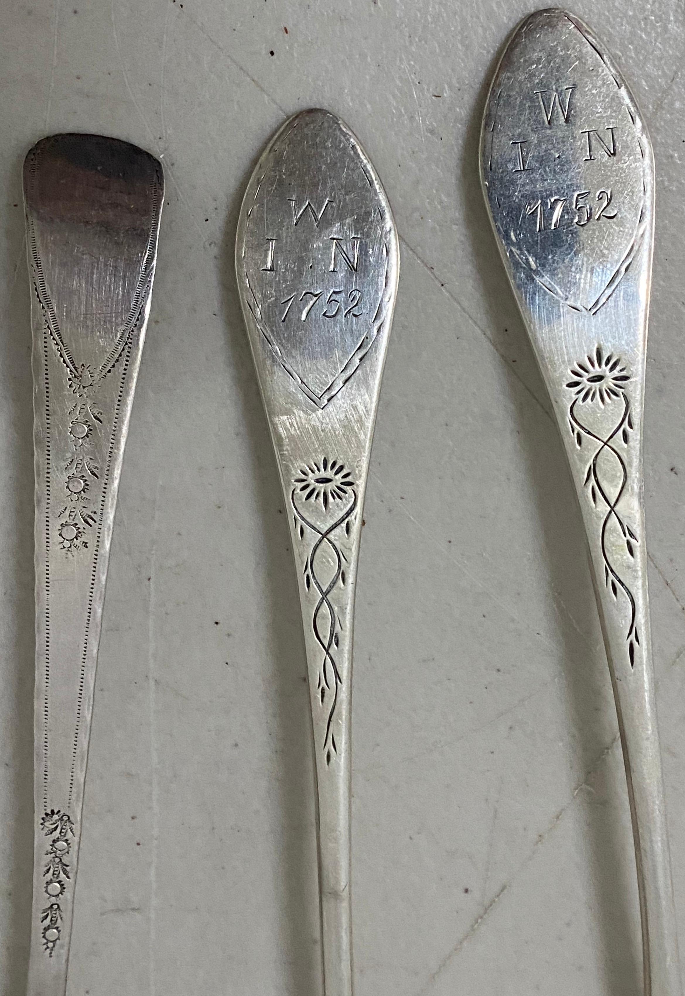 Three early American mid-18th century etched sterling spoons, circa 1752

Two spoons etched on the back with name

One spoon etched on the neck with floral pattern

Two spoons, dated 1752

Good antique condition.