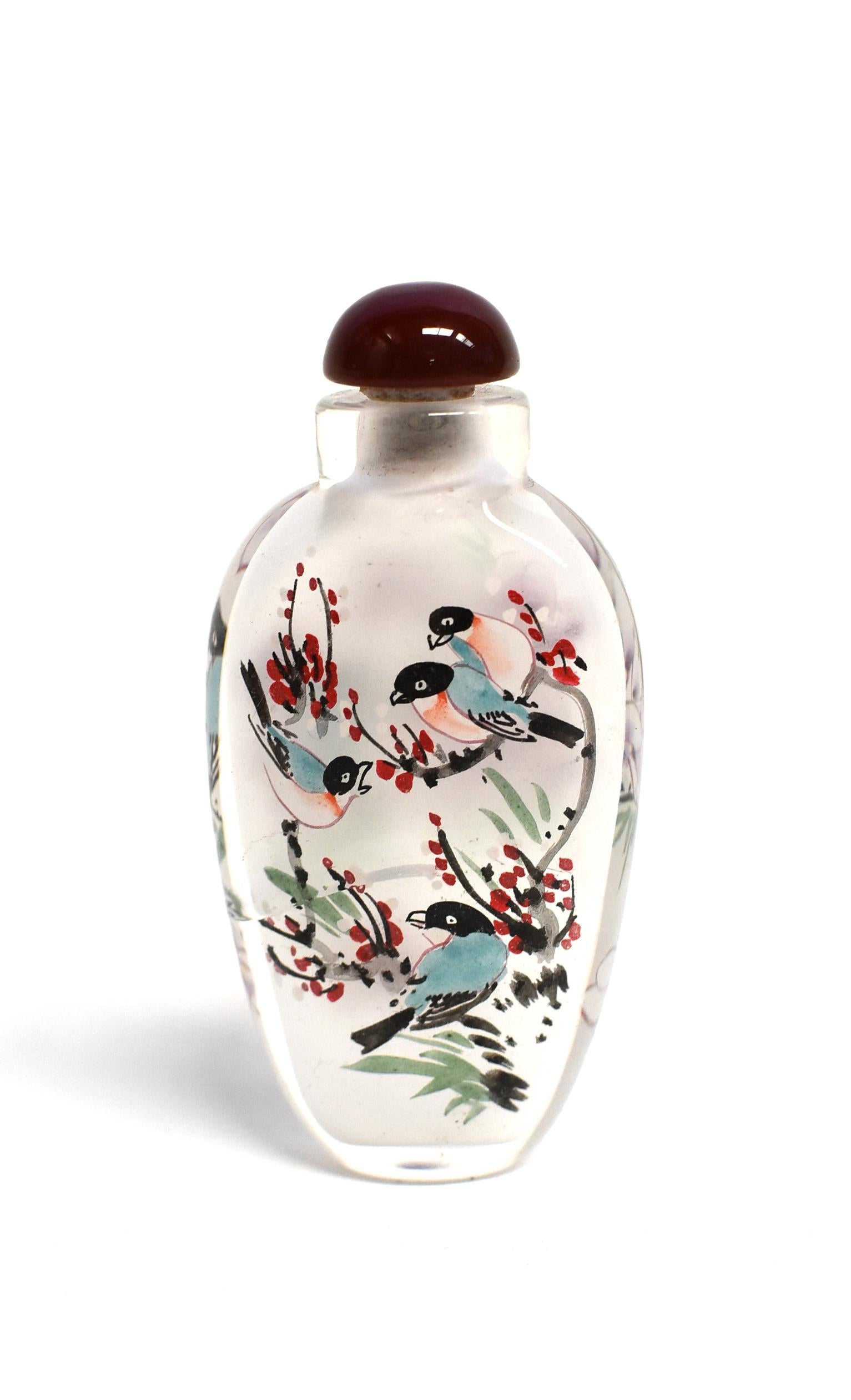 Chinese Three Églomisé Reverse Painted Snuff Bottles with Magnolia and Orchid For Sale