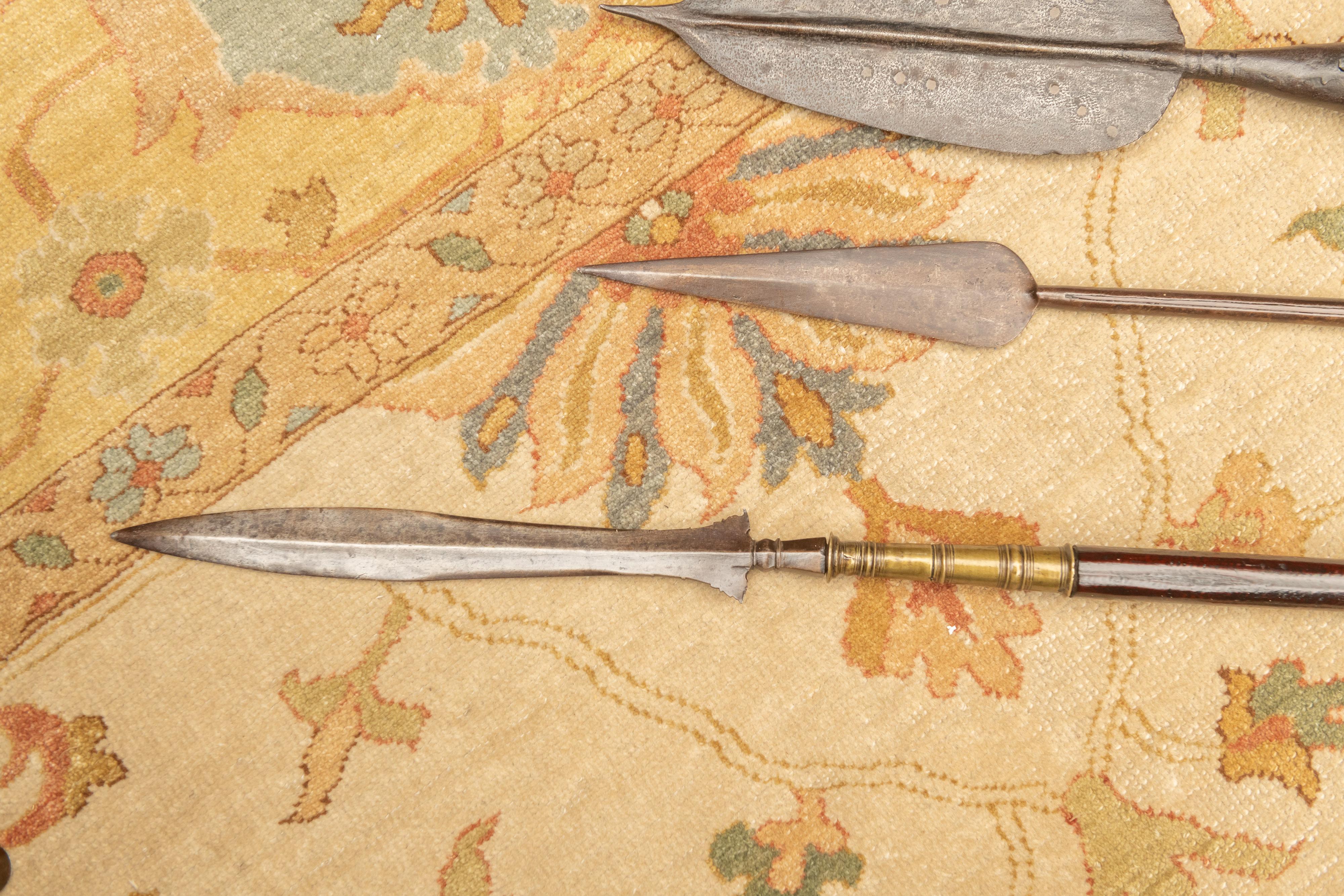 Three elegant African forged steel and exotic hardwood spears.
Three different spear heads hand forged and mounted to dark hard wood handles. Very deep patina overall. These are serious weapons.
Said to have been collected in the former Belgian