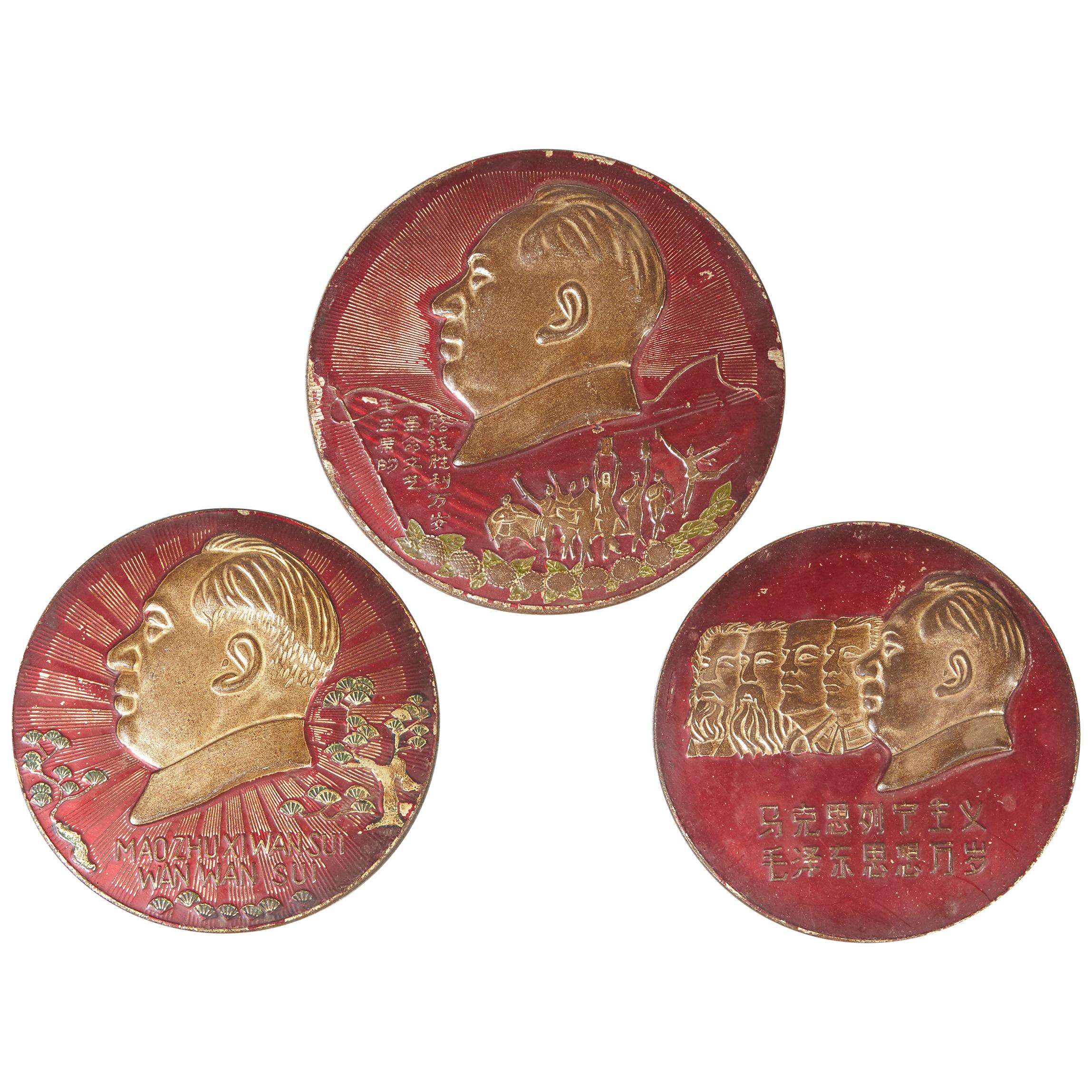 Three Embossed Metal Cultural Revolution Plaques with Images of Mao