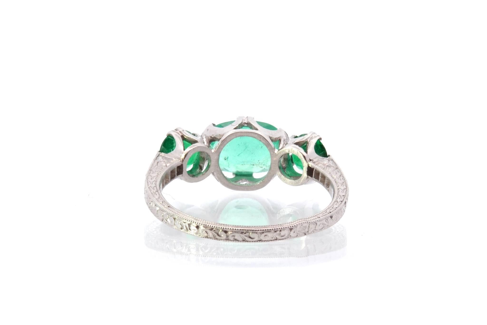 Women's or Men's Three emeralds and diamonds ring in platinum