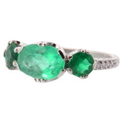 Three emeralds and diamonds ring in platinum