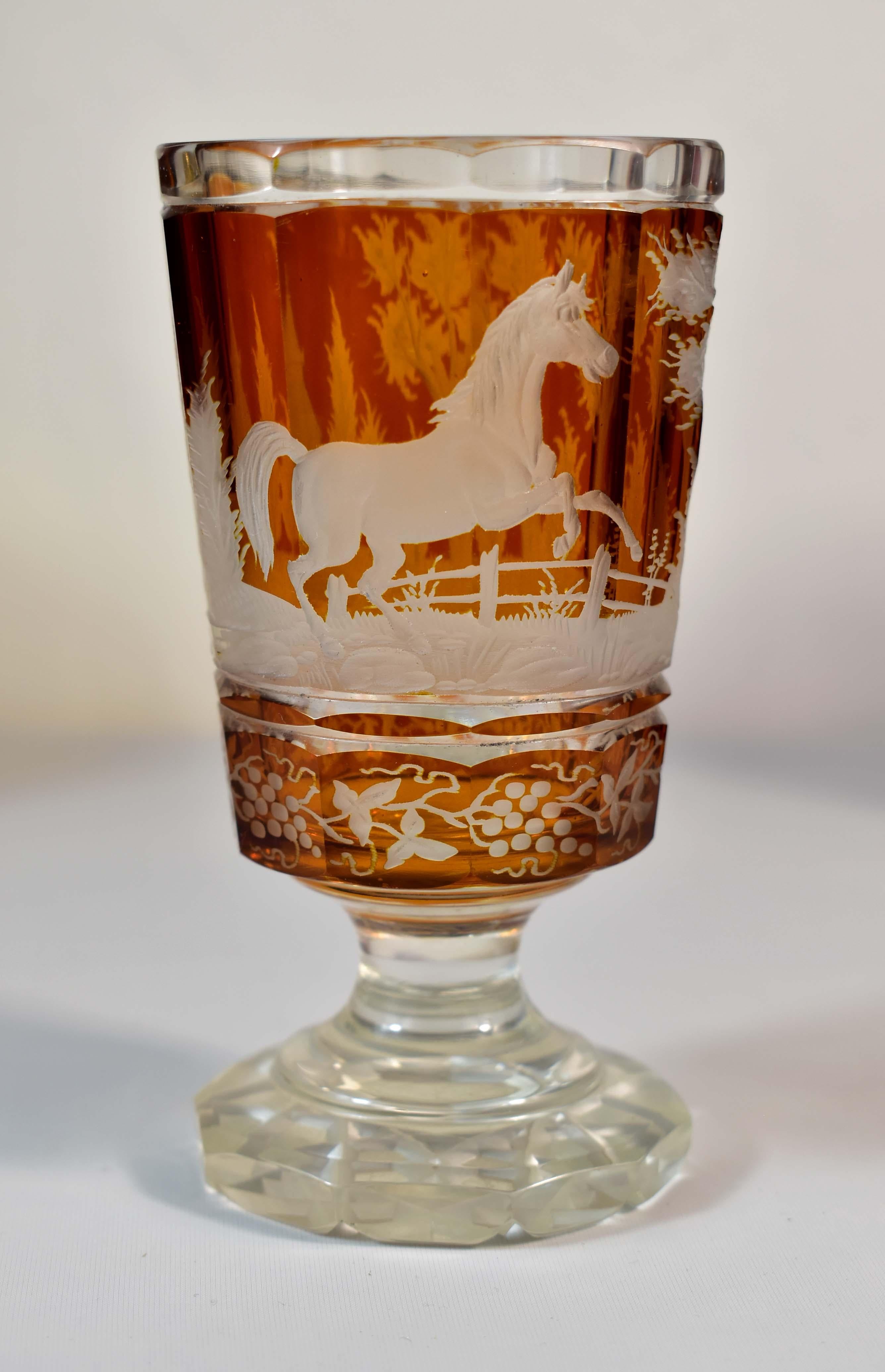 The first goblet is clear cut with a yellow lazure, Six cut medallions in which miniatures of horses are engraved. Everything is complemented by painting and gilding, It is 100% handmade, probably from the turn of the 19th-20th century  - height: 