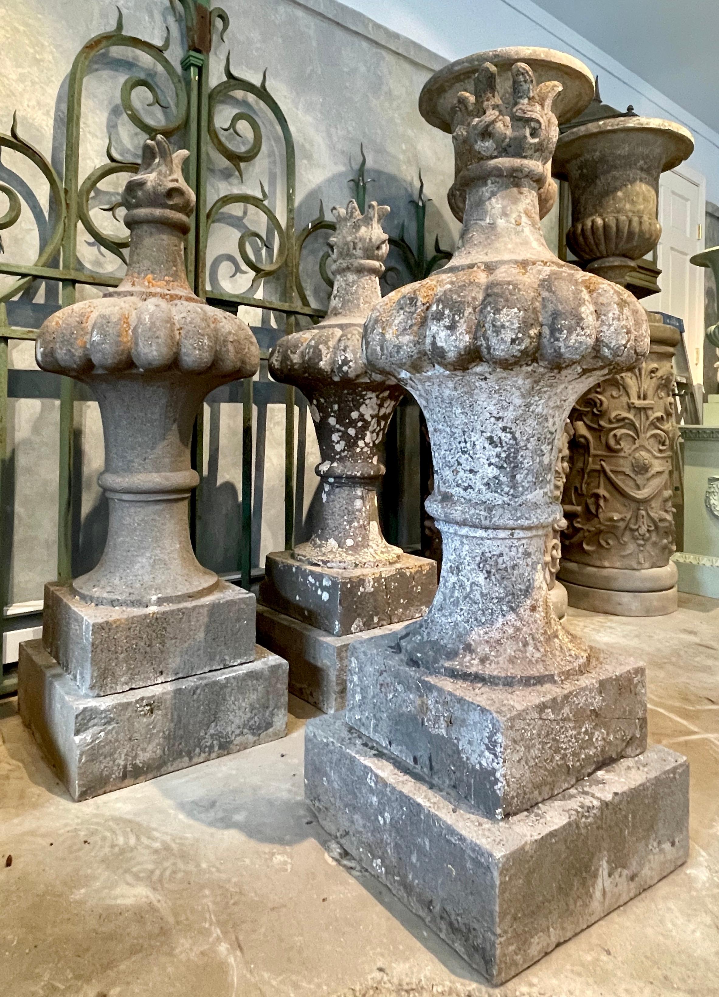 These incredible flame finials once graced a private castle just outside of Nemur, Belgium and they are exceptional in all respects. Deeply and crisply carved, each features an intricate flame rising from a semi-lobed body on a rising, flared socle