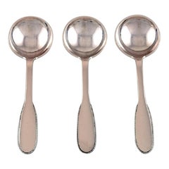 Three Evald Nielsen Number 14 Bouillon Spoons in Hammered Silver, 1920s