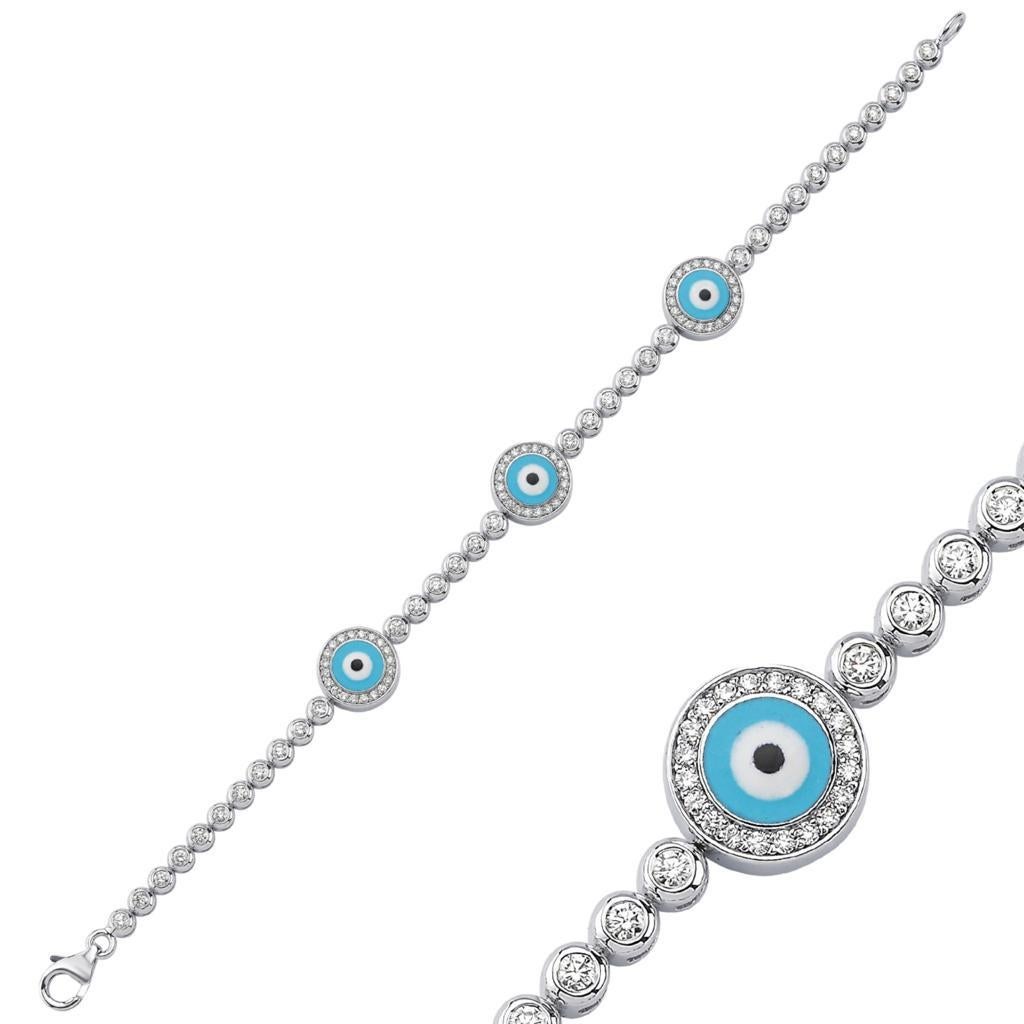 Three Evil Eye Diamond Tennis Bracelet, Made of 14k White Gold with Diamonds 1.40 carat & Blue Topaz 18.66 ct.
Chain measures 6 3/4