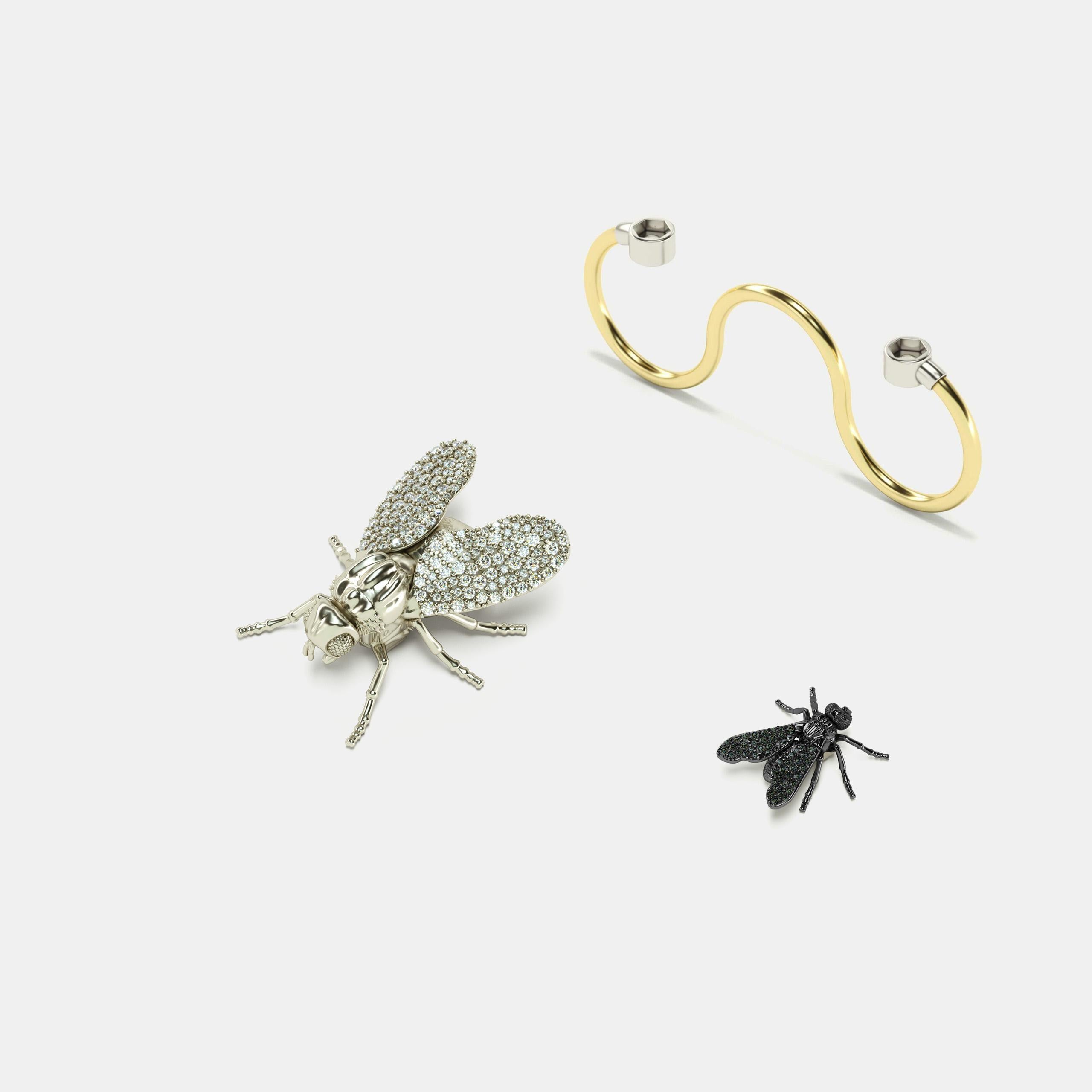 Three-Finger Cocktail Ring with Flies Full pavé white & black Diamonds
Big Fly (White Gold, 18K) with 160u. (1mm Ø) H/SI
Fly (Black Gold, 18K) with 44u. (1mm Ø)


ECH JEWELRY, Ode to the Revolution in Fine Jewelry!  
The owner can easily dismount