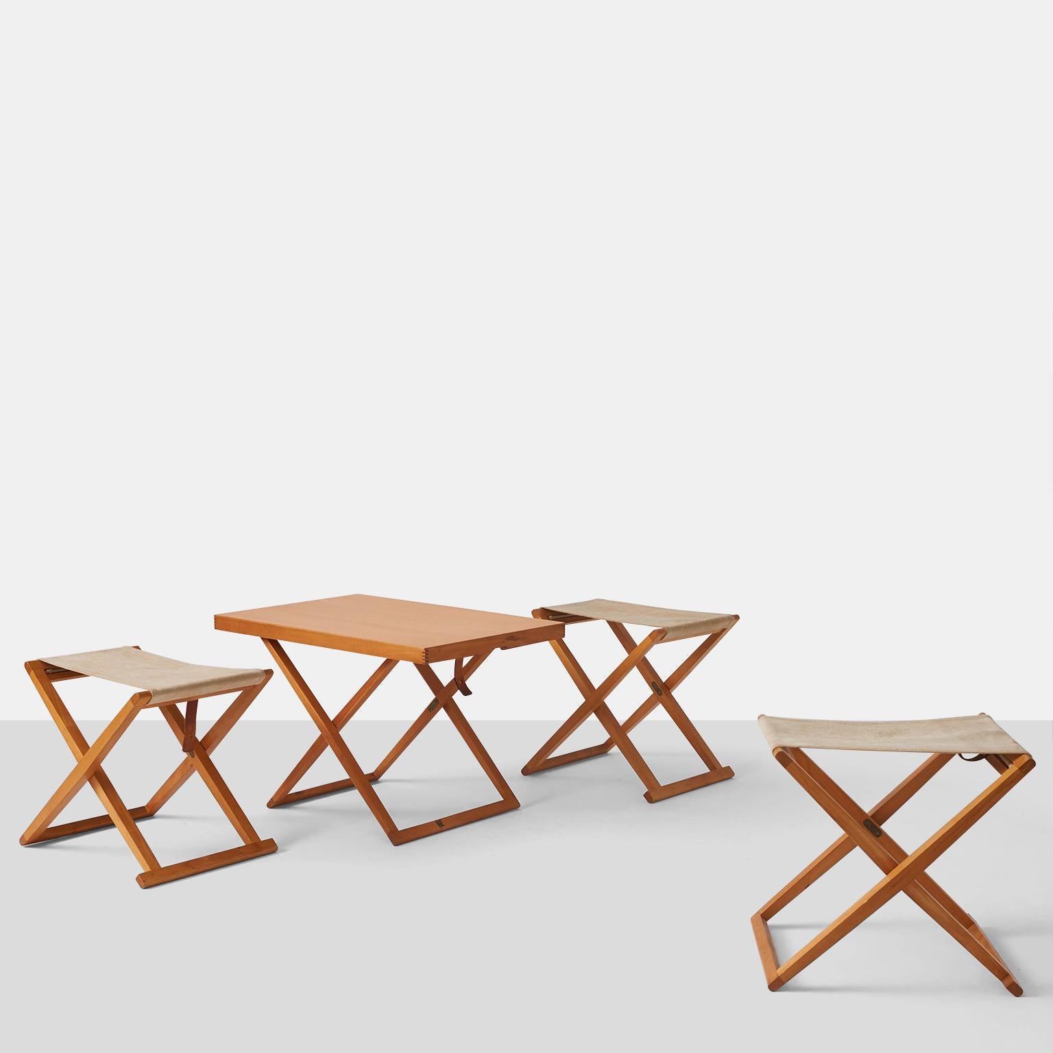 A trio of folding stools, designed by Mogens Koch for Rud Rasmussen in 1932. Lightly restored frames with new brass hardware and new natural colored canvas seats.