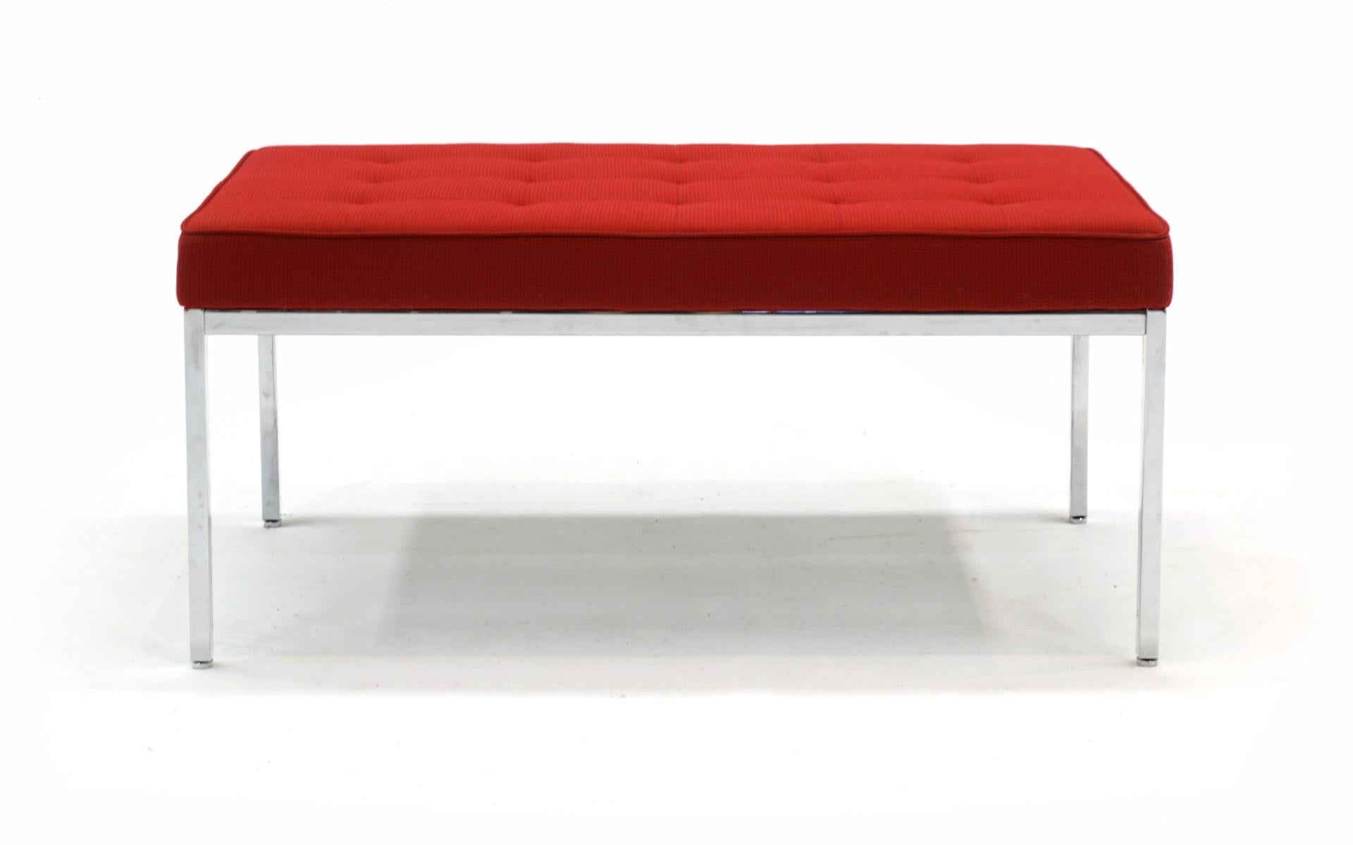 Two seat Florence Knoll Bench in red knoll fabric and heavy chromed steel frame. Produced in 2009, this bench has seen very little use. Very good condition with no stains or tears to the fabric. All feet are intact and the chrome finish is bright