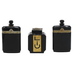 Tre bottiglie di profumo in vetro nero francese Art Deco