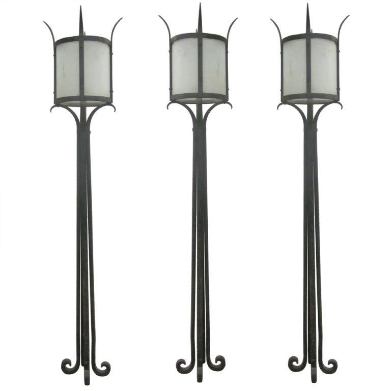 Three French Mid-Century Wrought Iron Floor Lamps Attributed to Raymond Subes For Sale