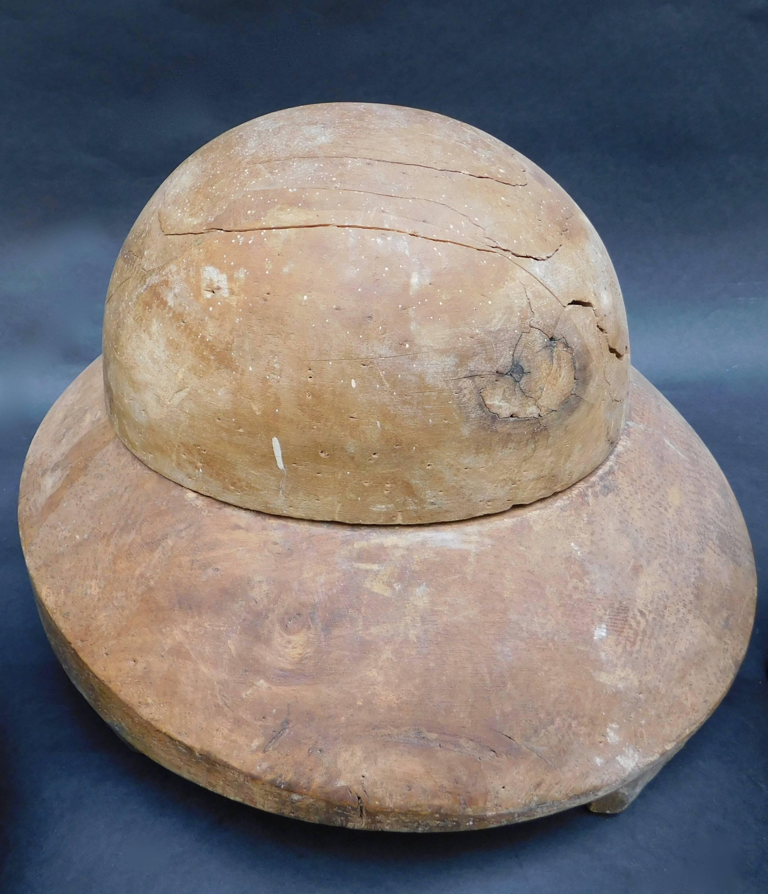 Very sculptural French wood hat block form for making ladies hats.
 Straw or wool felt is tacked onto the wood form (notice the numerous holes) and then steamed and hand manipulated with great skill by the milliner to create the desired form.

