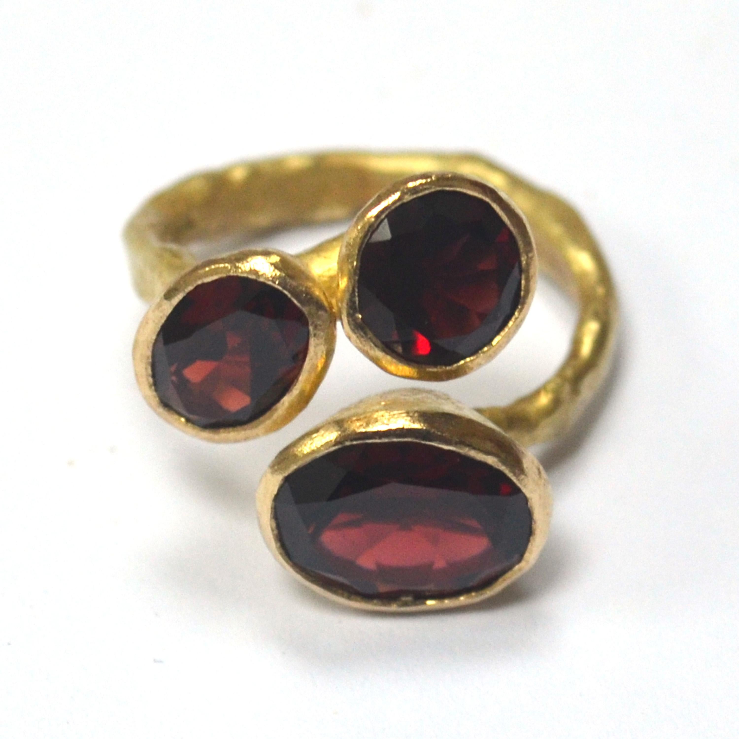 Oval Cut Three Garnet Cluster 18 Karat Gold Textured Ring Handmade by Disa Allsopp