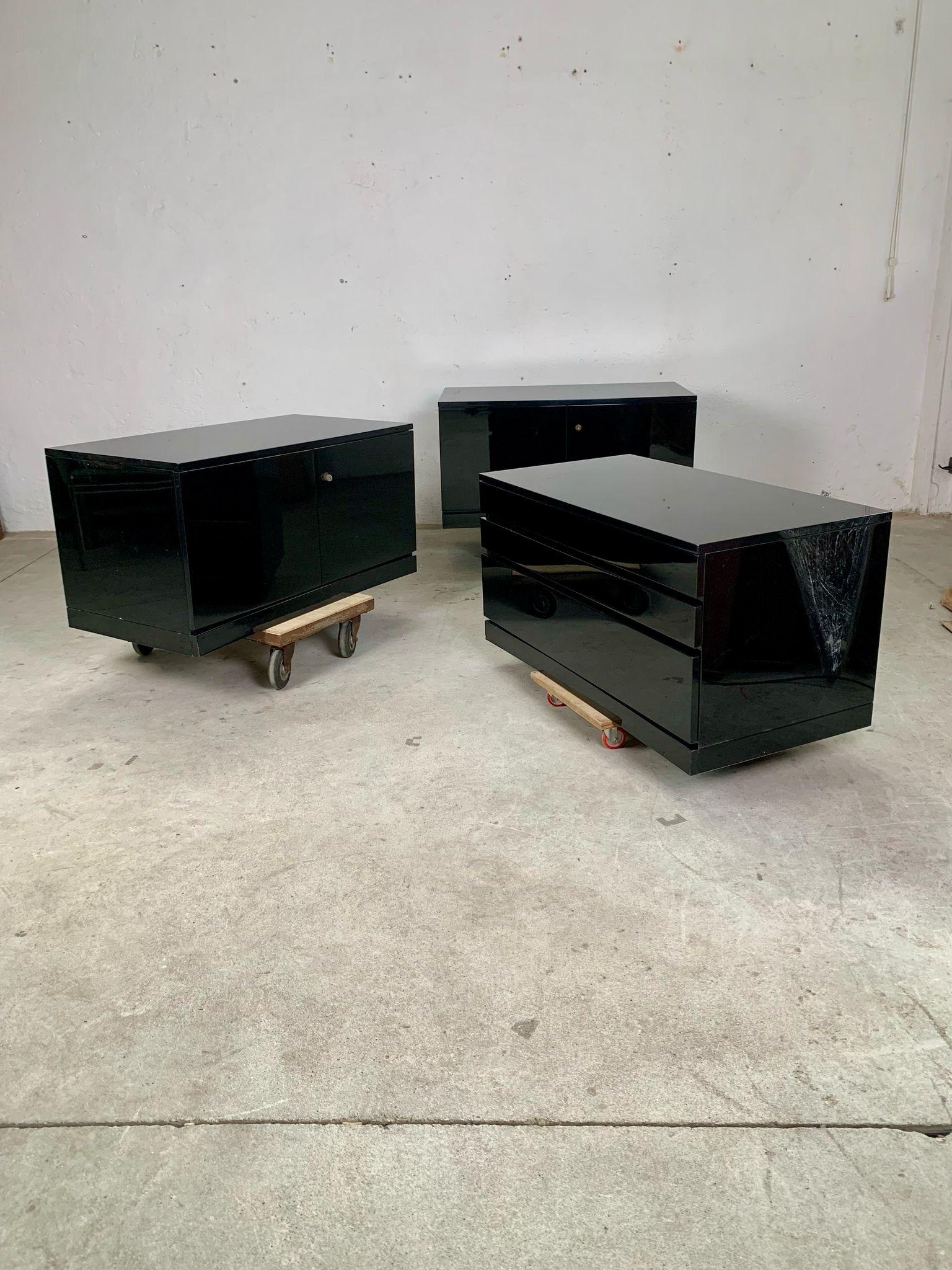 Three glossy lacquered storage modules, 1970s

Three storage modules, which can be composed as desired by using them separately or together to form a low sideboard. The three modules are two storage units with 2 hinged doors and a drawer unit. 
The