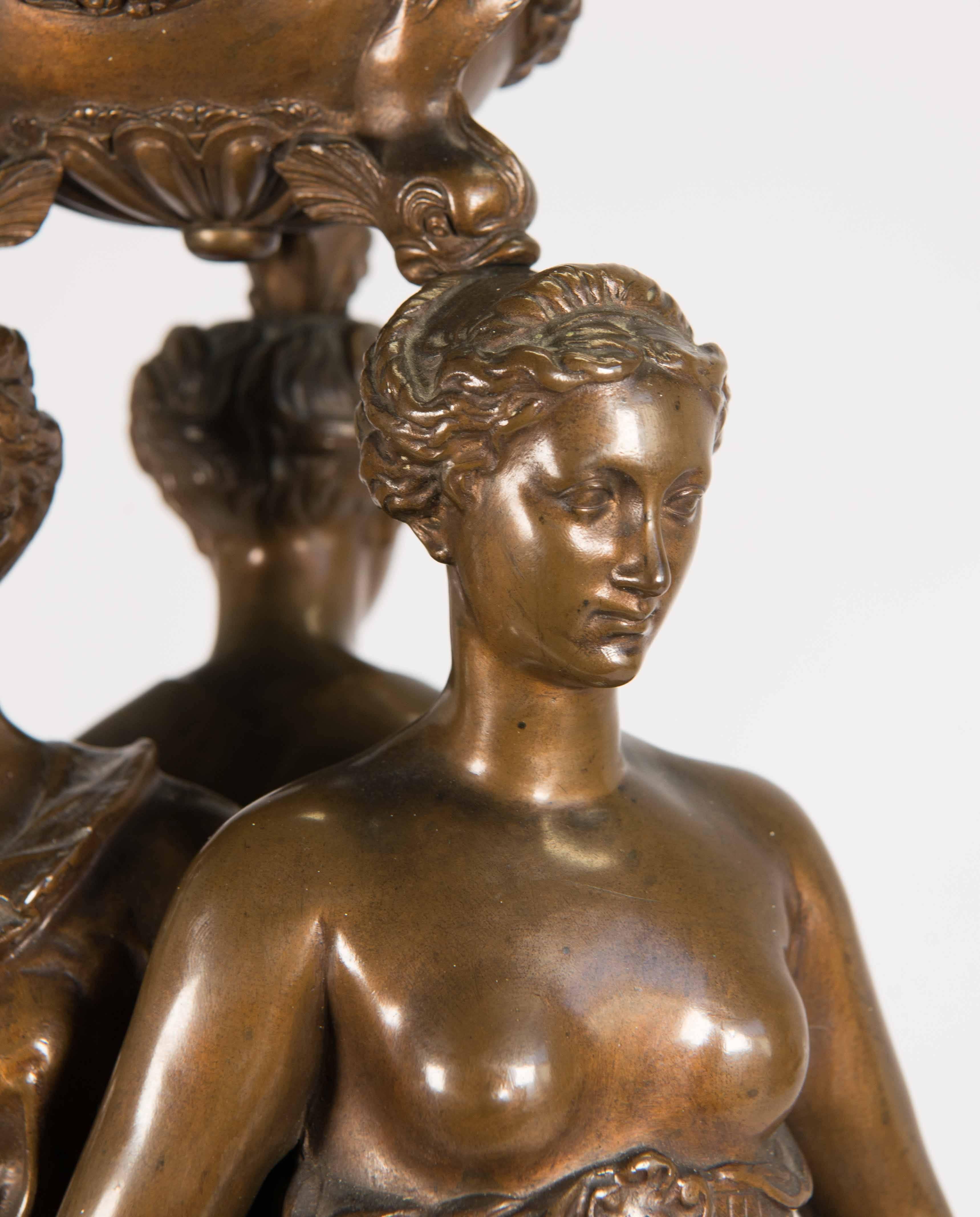 Well-known and respected for its quality bronze statues is Ferdinand Barbedienne. He was a metalworker during the 19th century. This is a statue of the three graces, after the model by Germain Pilon. The statue is 61 cm high and also has the stamp