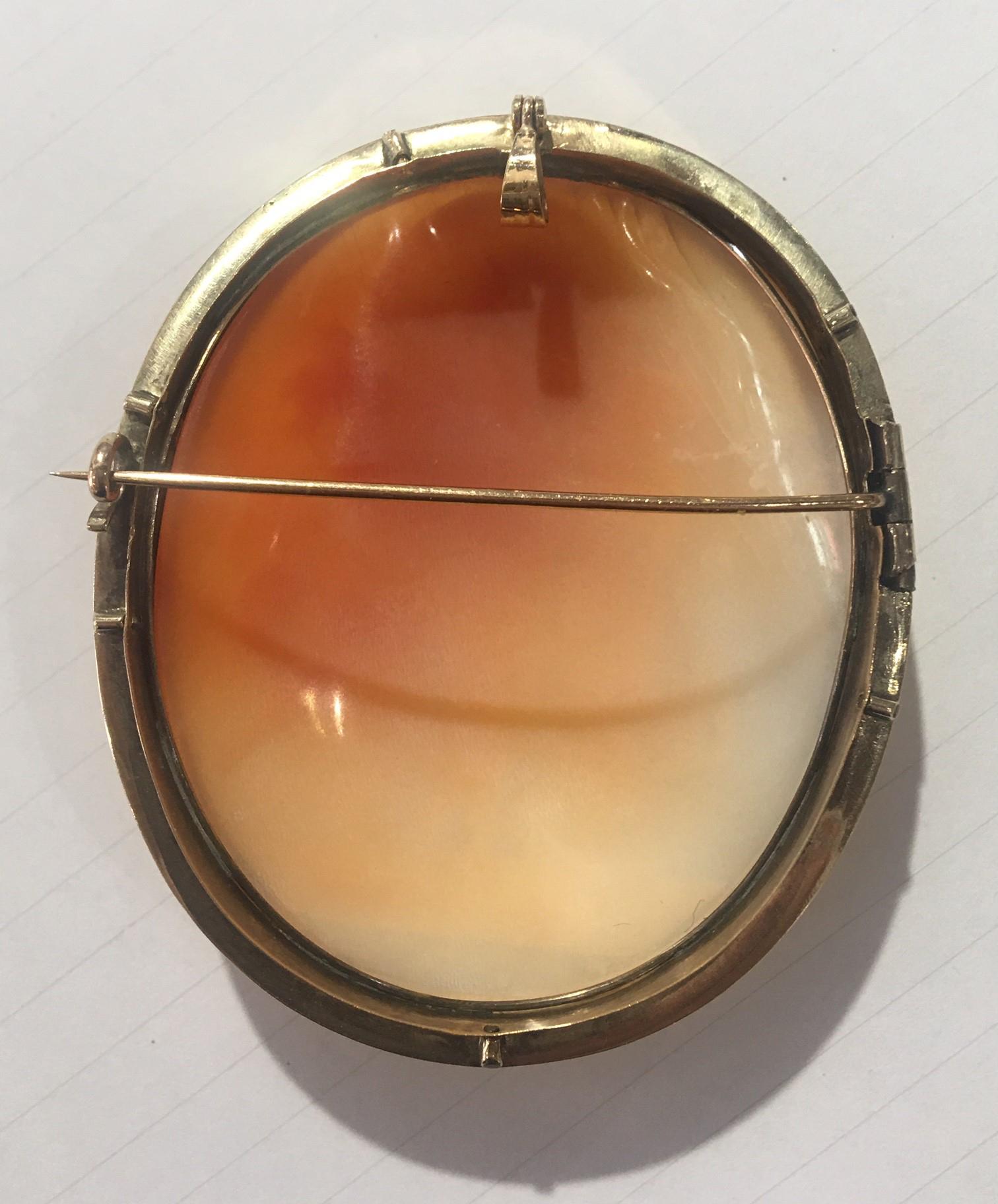 Elegant and Stylish Antique Cameo Brooch Pendant depicting The Three Graces; Beautifully Hand Carved in High Relief Estate piece; Meticulously artisan engraved with exquisite detail, this romantic natural carnelian shell cameo is set in a Beautiful