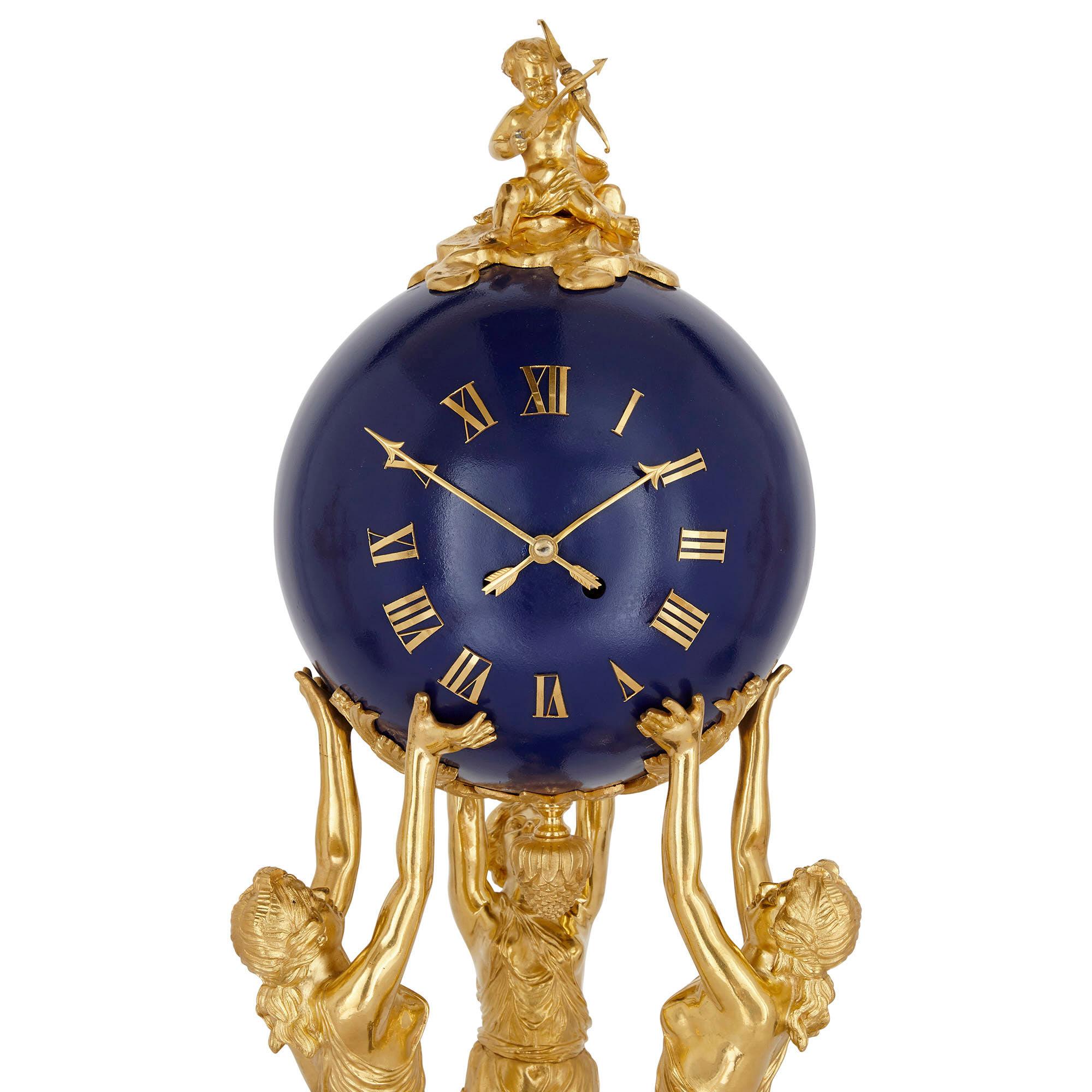 This garniture comprises three pieces: a mantel clock and two flanking candelabra, the entire ensemble designed and ornamented in an ornate neoclassical style. The garniture is composed of gilt bronze and lapis lazuli, with the lapis elements being