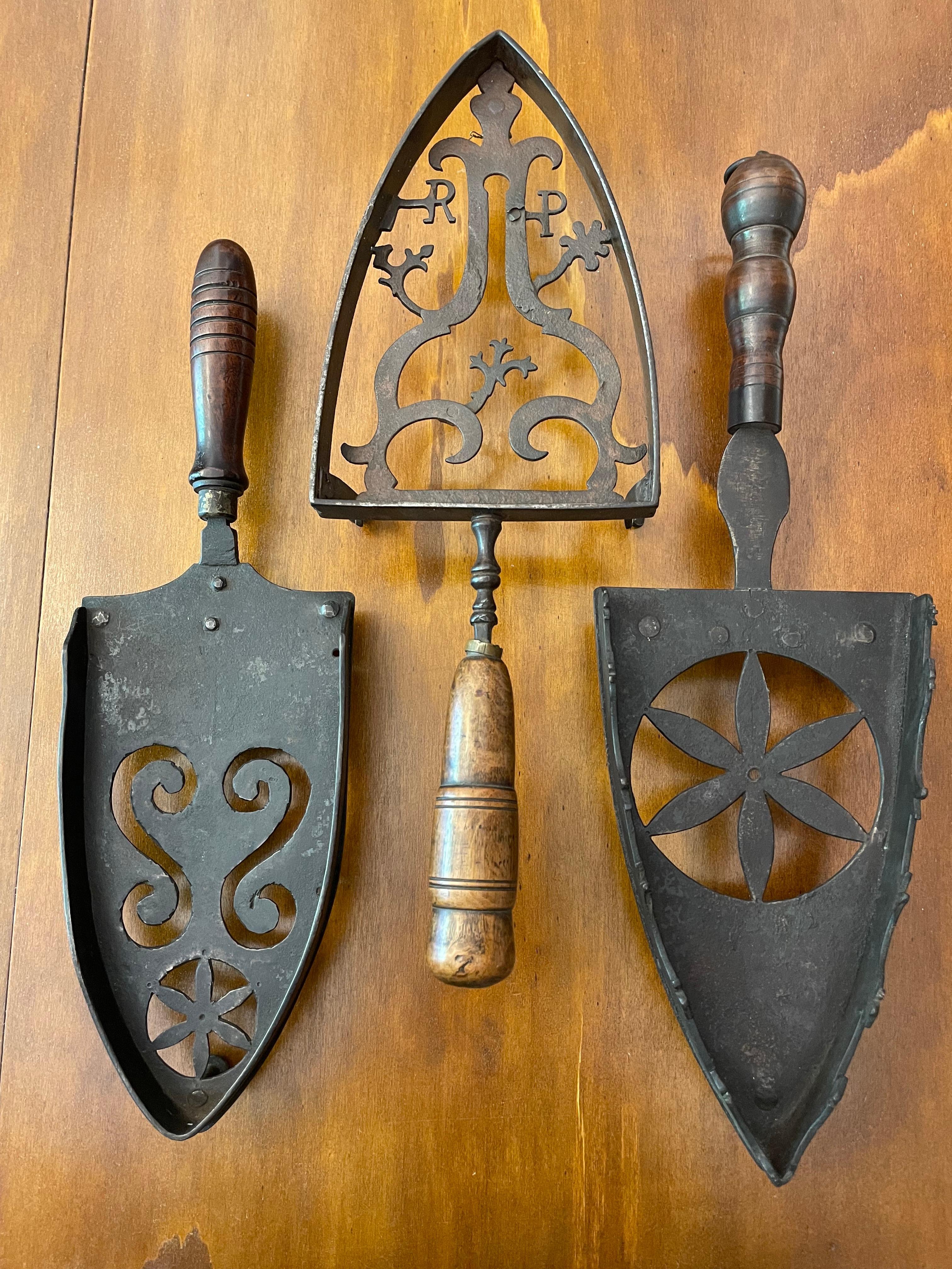 From Italy a unique set of three 18th and 19th century assorted Italian flat iron trivets used to place hot irons to protect the preservation of tables, cloth and from hot charcoal and sad irons. These items are in excellent condition and have minor