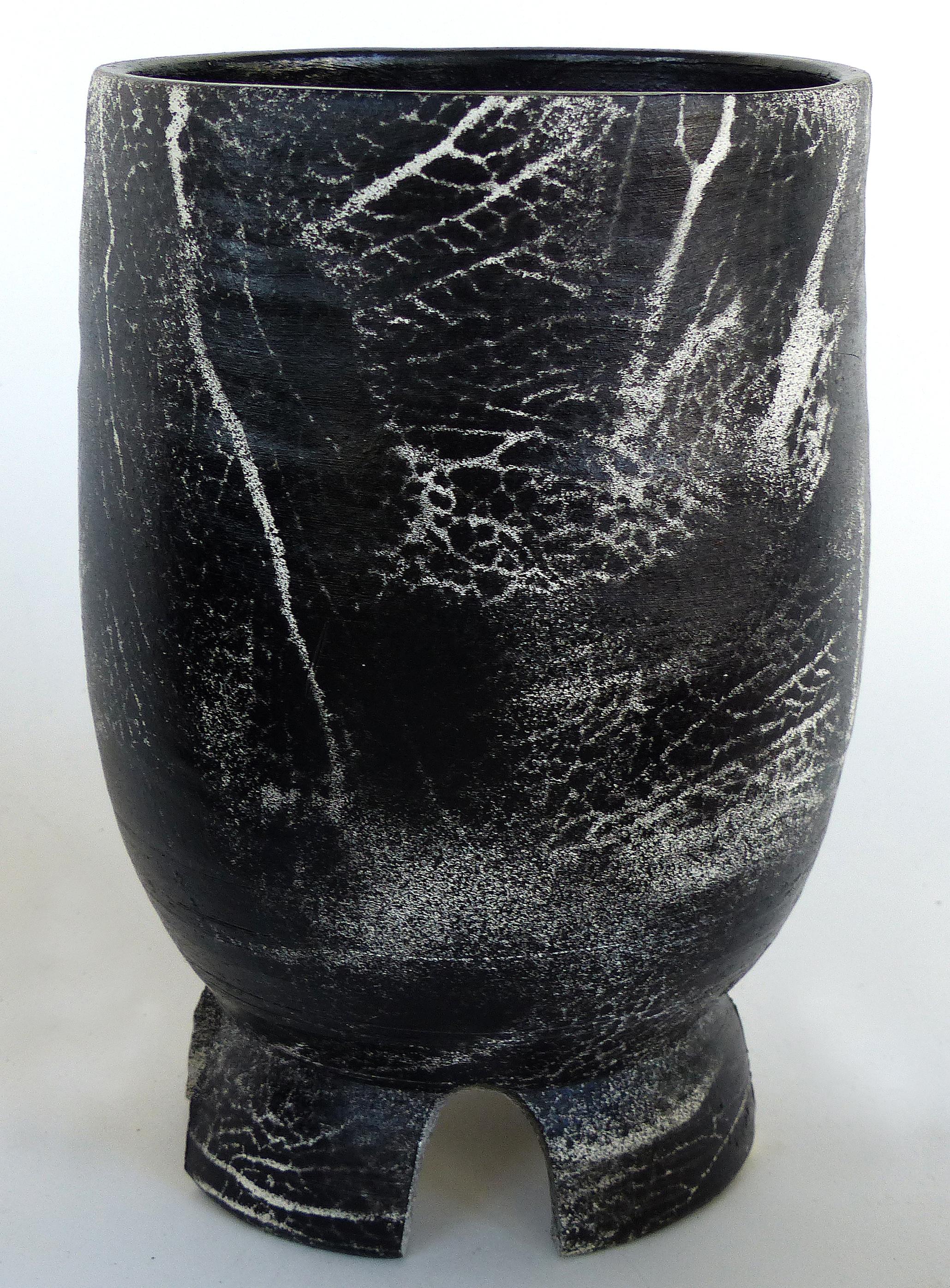 Three Hand Turned Ceramic Black & White Vessels by Ceramicist Gary Fonseca

Offered for sale is a set of three hand-turned ceramic vessels by the contemporary ceramist Gary Fonseca.
Tall vase form planter with drainage holes on base, 8.5