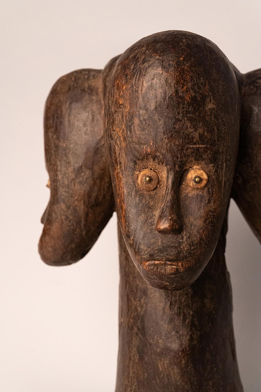Fang reliquary with three heads, eyes inlaid with bone pellets and copper nails. Equatorial Guinea, XXth c. 