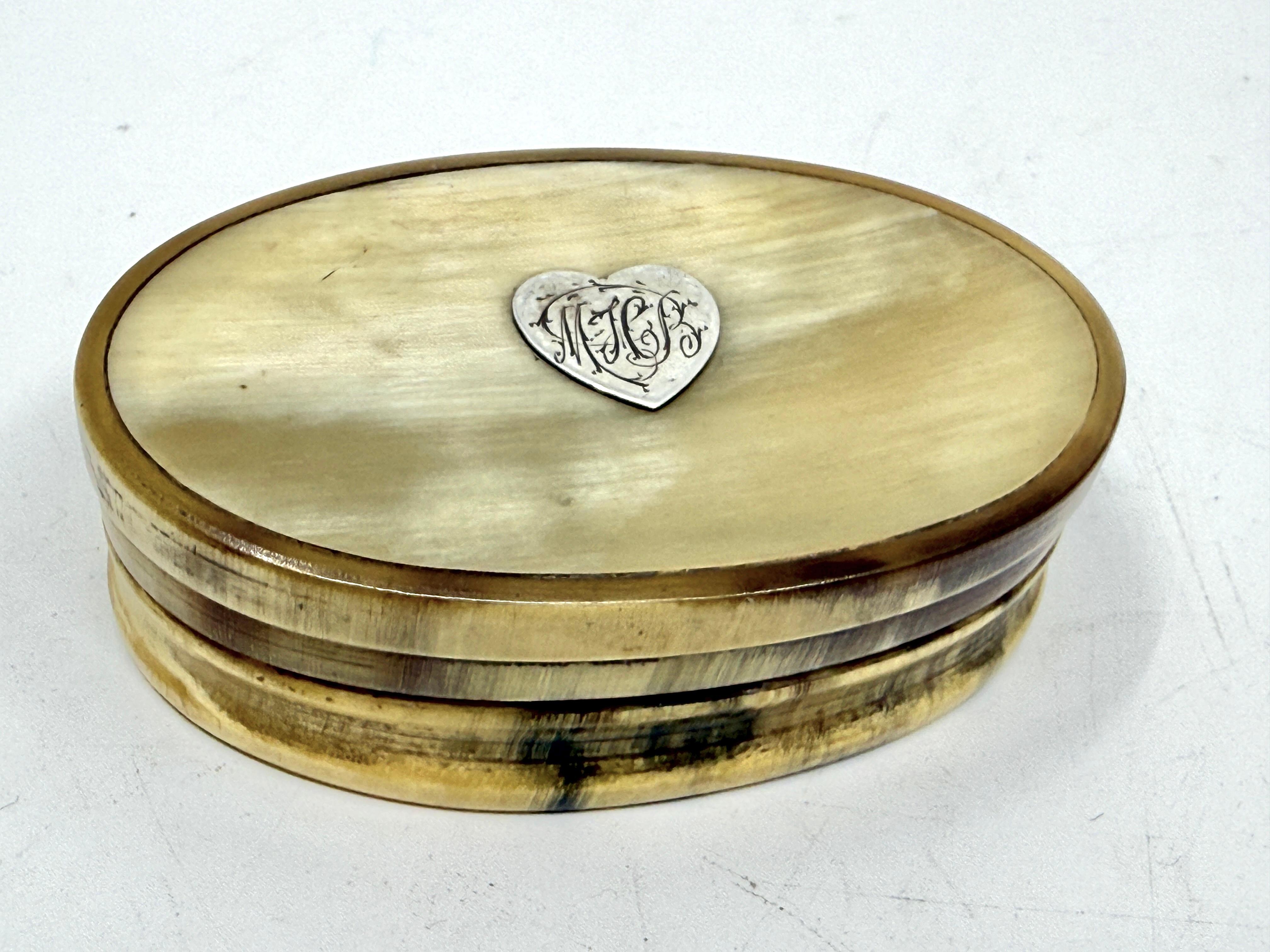 3 nice Victorian trinket or snuff boxes. One is oval and made of horn with Silver inlay. The next is a long oval out of some exotic horn and has a hinge on top, and a portion lifts of. This one has a crack through the top and the top is a bit warped
