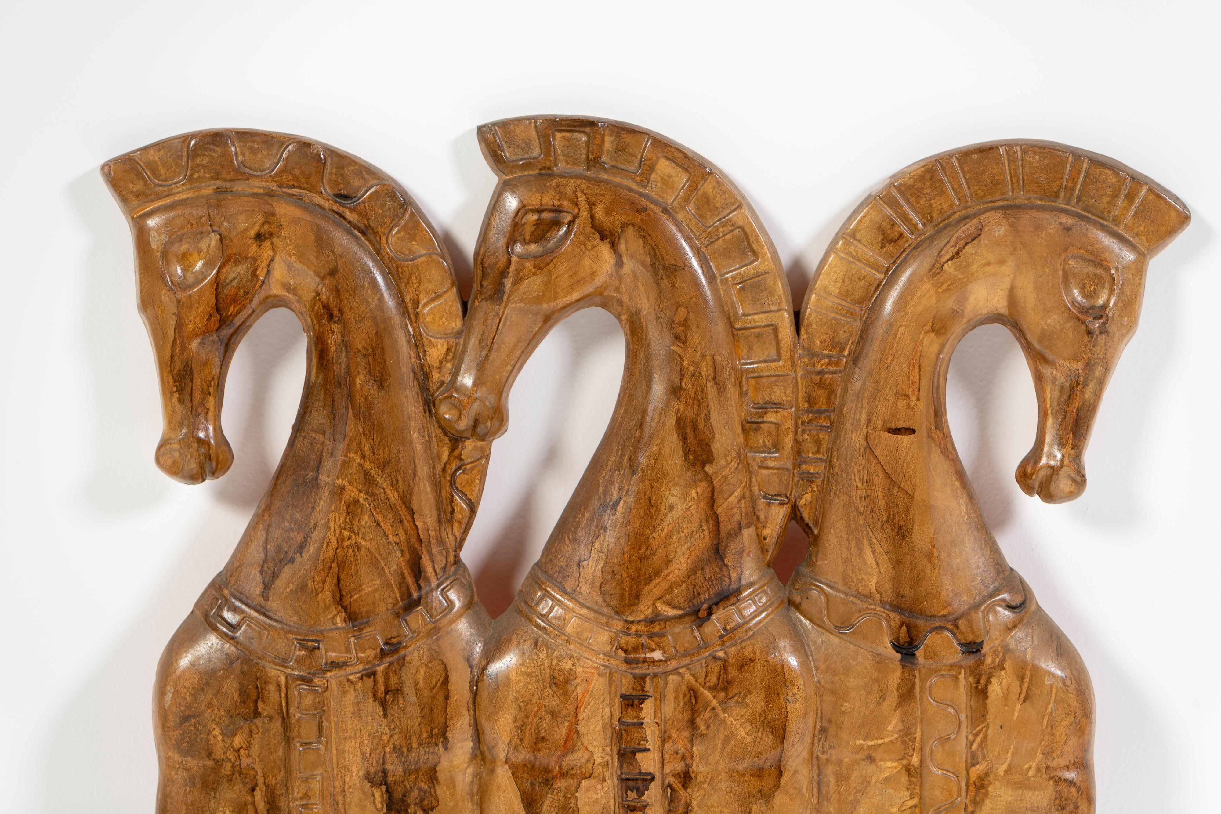 Vintage trio of Etruscan horses made of painted resin, mounted on a steel bar, by Frederick Weinberg, circa 1950-1960. Popularized in the Mid-20th Century, the ancient Etruscan horse is a simply of strength. Standing proud and majestic, Weinberg's