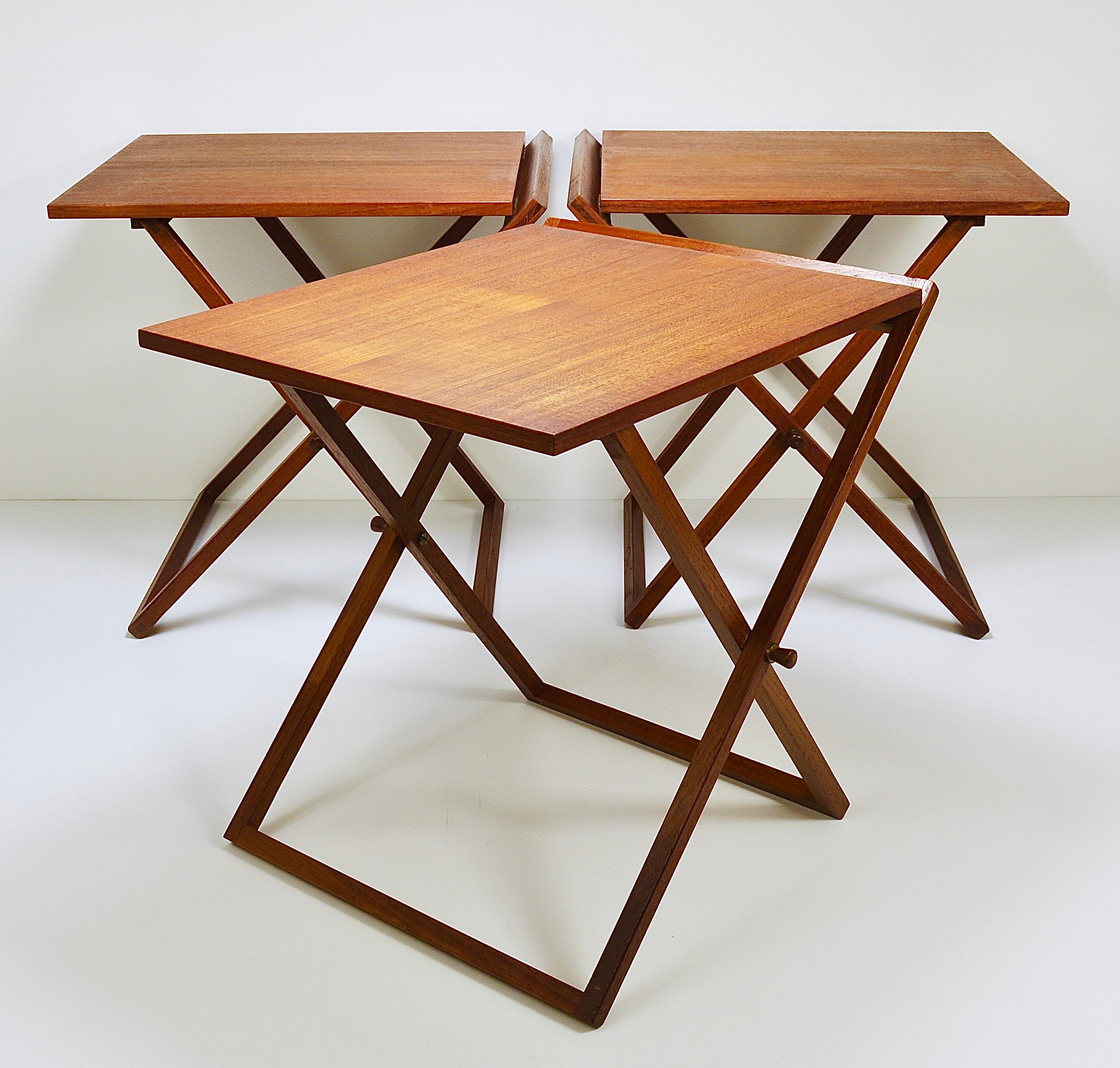 Up to three Mid-Century Modern fold out tables from the 1960s. Designed by Illum Wikkelso, executed by the Scandinavian manufacturer CFC Silkeborg Furniture Makers in Denmark. Sold and priced per piece. Very nicely manufactured, with nice sculptural
