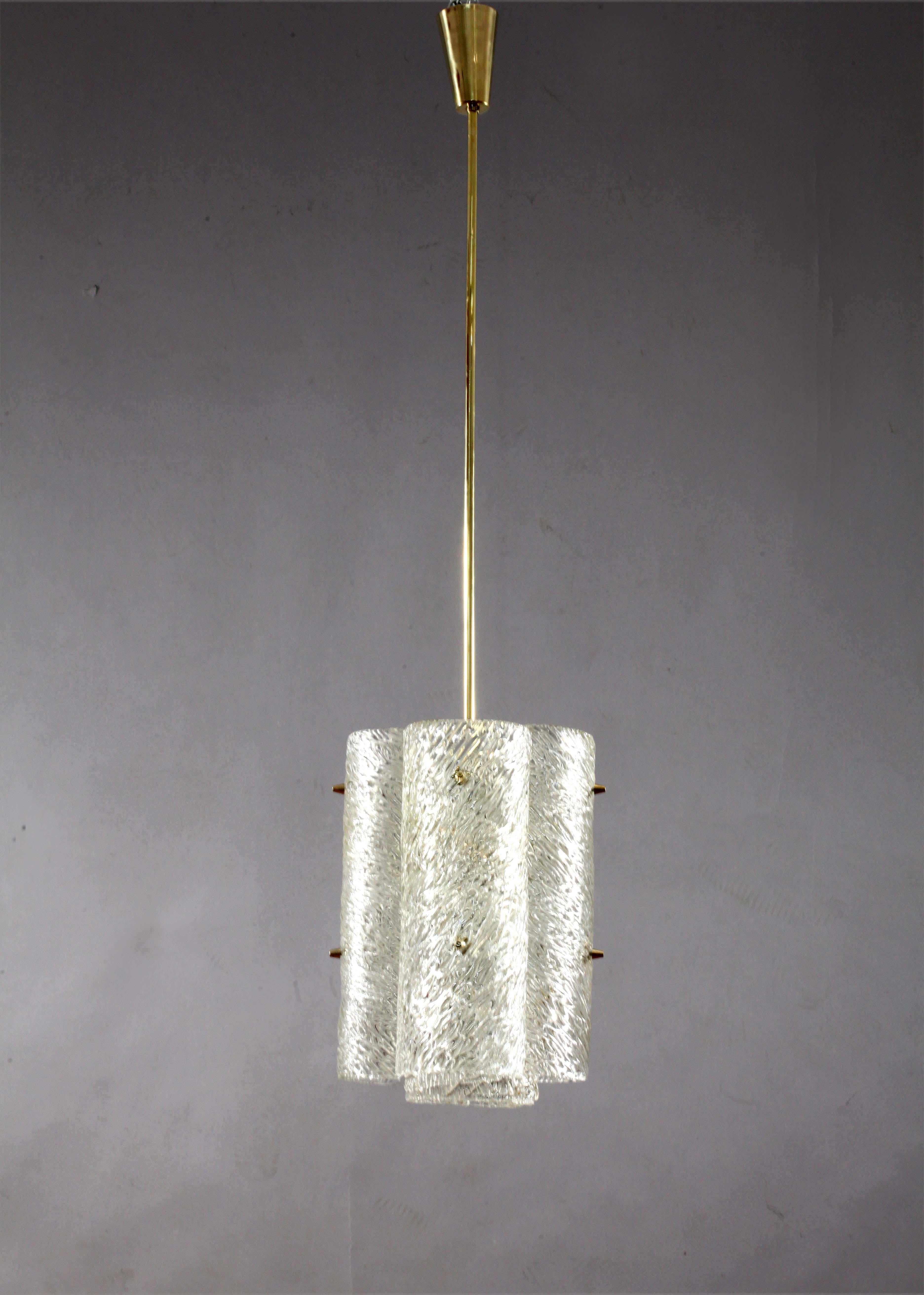 Three chandeliers,
J. T. Kalmar 
Vienna 1960
textured Ice glass chandelier,
lacquered brass , brass stam, five bulbsockets E 27.
Please note that we can provide you with different sizes/length of stems or even switch to a chain, according to