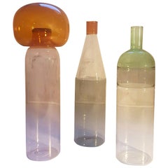 Three Italian Bottles in Blown Glass Colored in Pink Green Grey Orange, Milano
