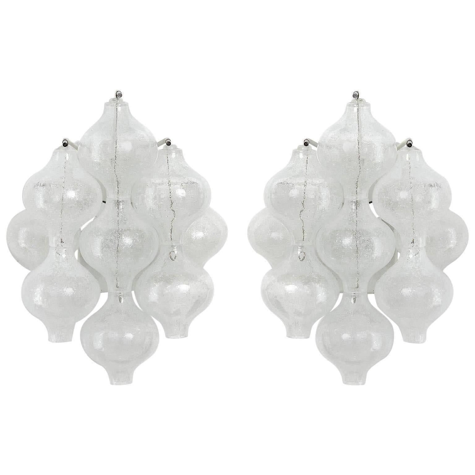 One of three 'Tulipan' glass wall light fixtures by J.T. Kalmar, Austria, Vienna, manufactured in midcentury, circa 1970 (late 1960s or early 1970s).
The name Tulipan derives from the tulip shaped hand blown bubble glasses. Each glass is handmade