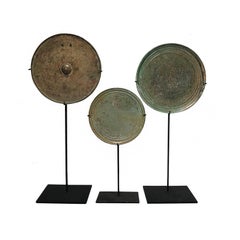 Three Khmer Bronze Mirrors, 13th - 15th Century