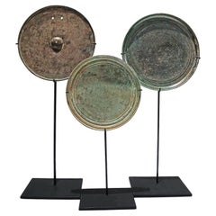 Three Khmer Bronze Mirrors, 13th - 15th Century