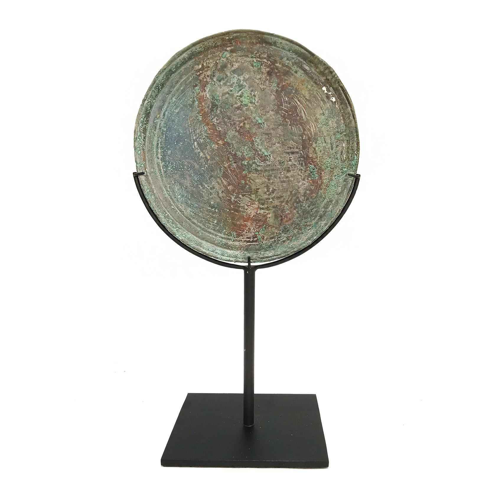 Bronze mirrors preceded the glass mirrors of today. Sometimes termed a copper mirror, they have been found by archaeologists in various cultures, from Etruscan Italy to Japan. Typically they are round and rather small, in the West with a handle, in