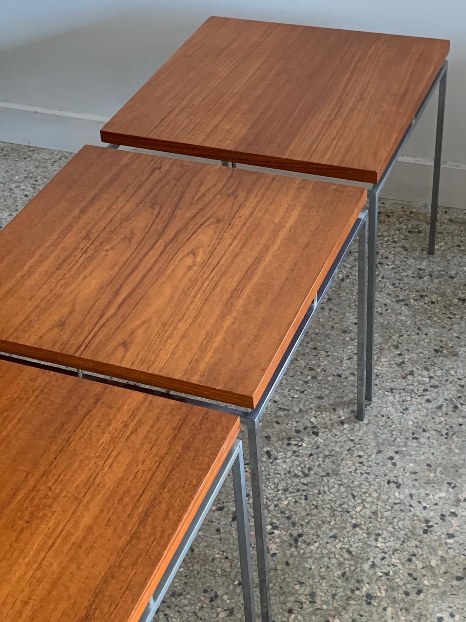 A classic Knud Joos occasional table in steel and teak for Jason Mobler, model 600. Priced individually at $1,500. Classic Minimalist design. Three available.