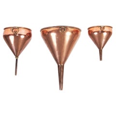 Three Large Copper Funnels