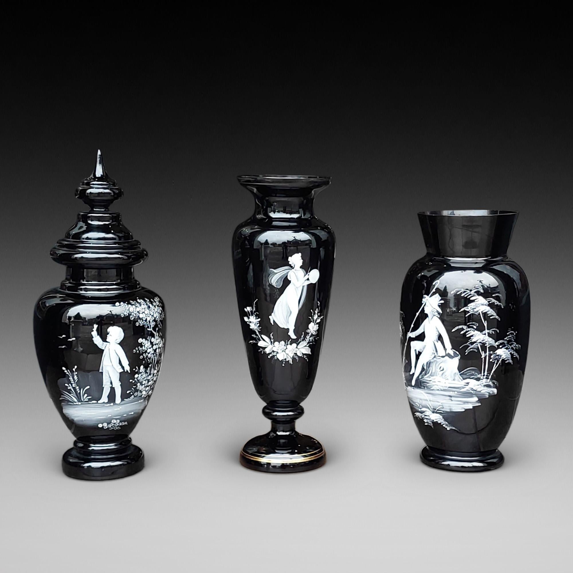 Three Large Pieces of 19thC Glass by Mary Gregory - comprising of two black glass vases and an urn - 5.5