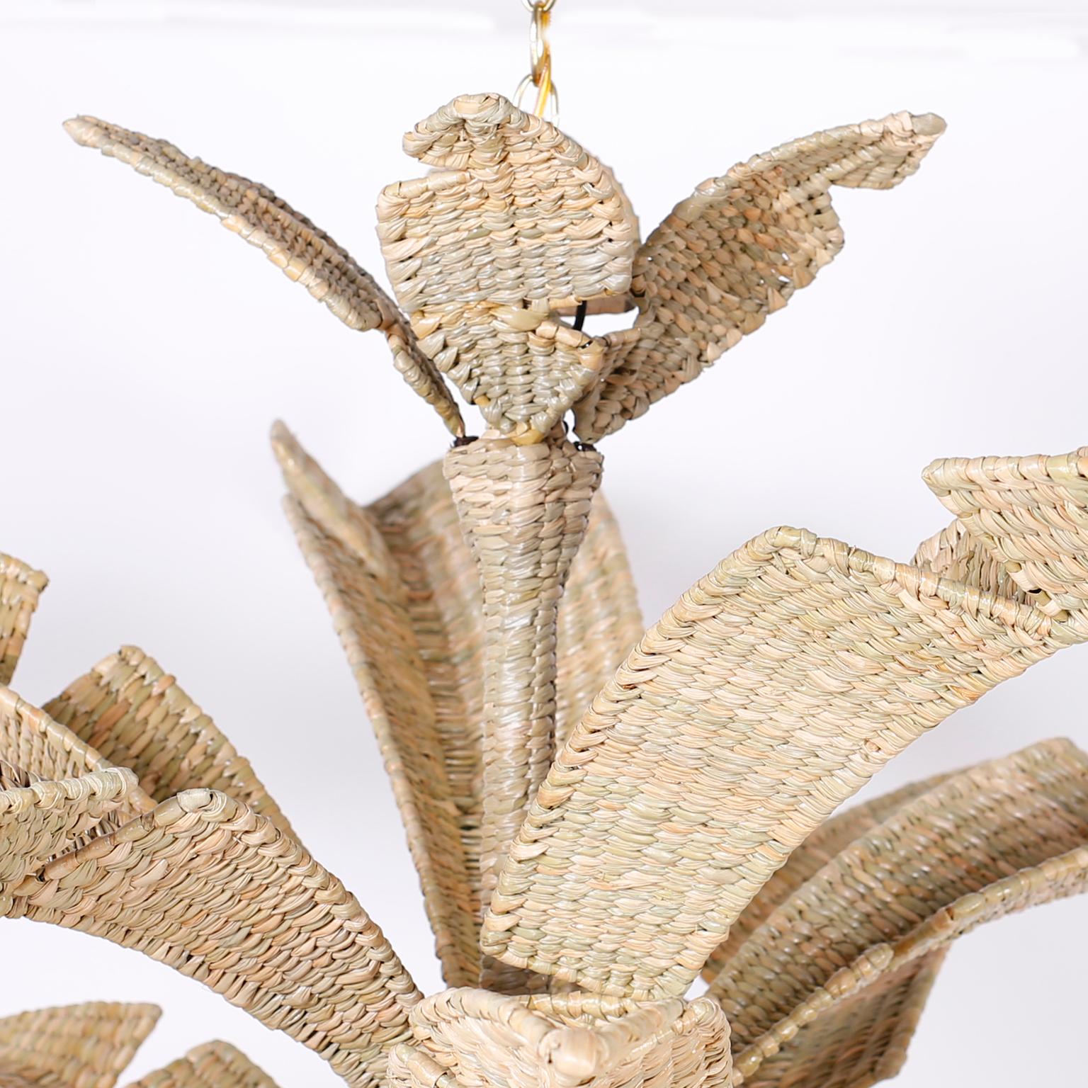 Wicker eight-light palm leaf chandelier or light fixture hand formed and welded with a metal frame ambitiously hand wrapped in reed with a casual elegance. A sophisticated chandelier, channeling the craft of rural Mexico, in the manner of Mario