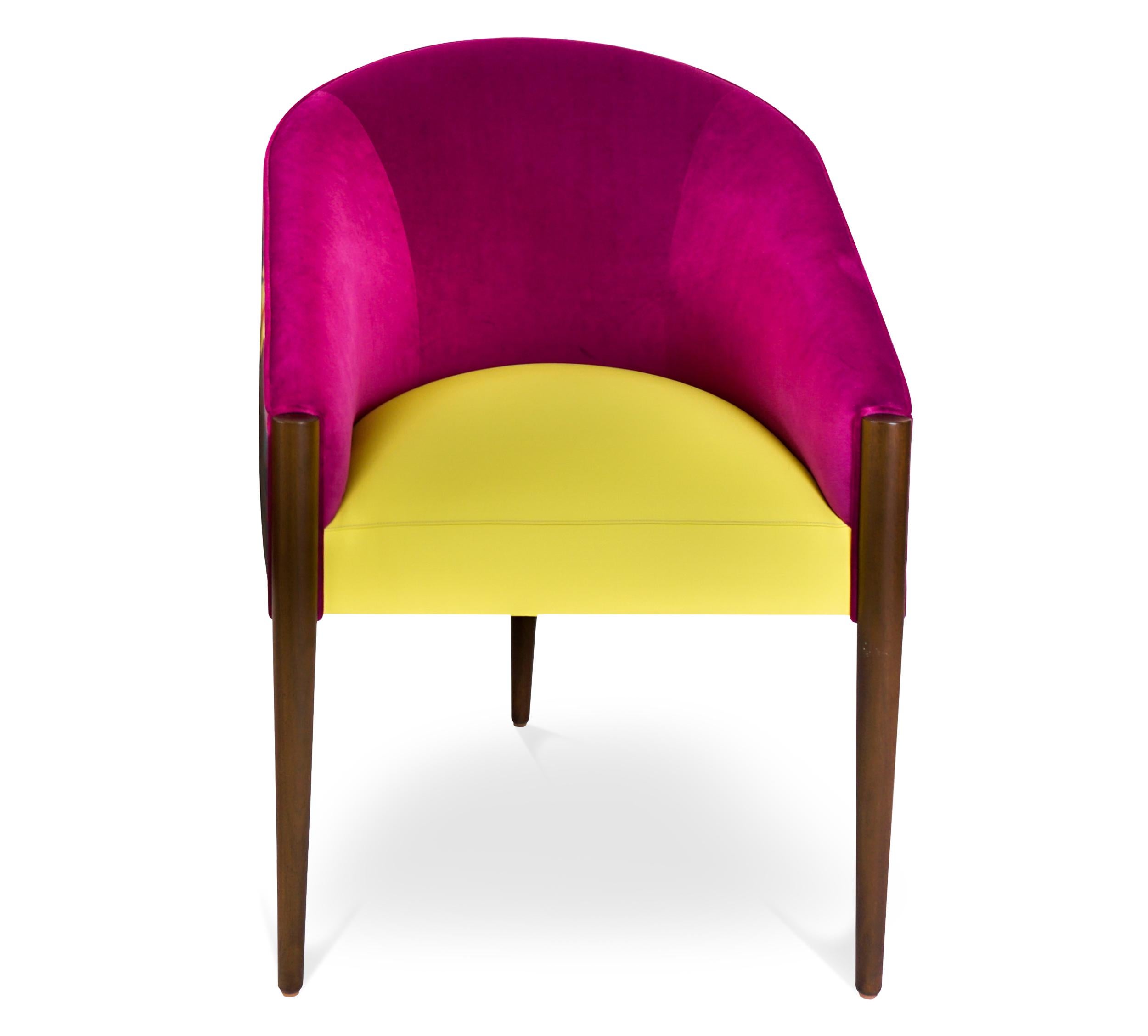 Fully customizable three-legged dining chair with bucket frame and slope arm. Made to feature three materials but can be upholstered all in one. As shown, fuchsia performance low pile velvet on inside back, baby dandelion vinyl seat and faux silk