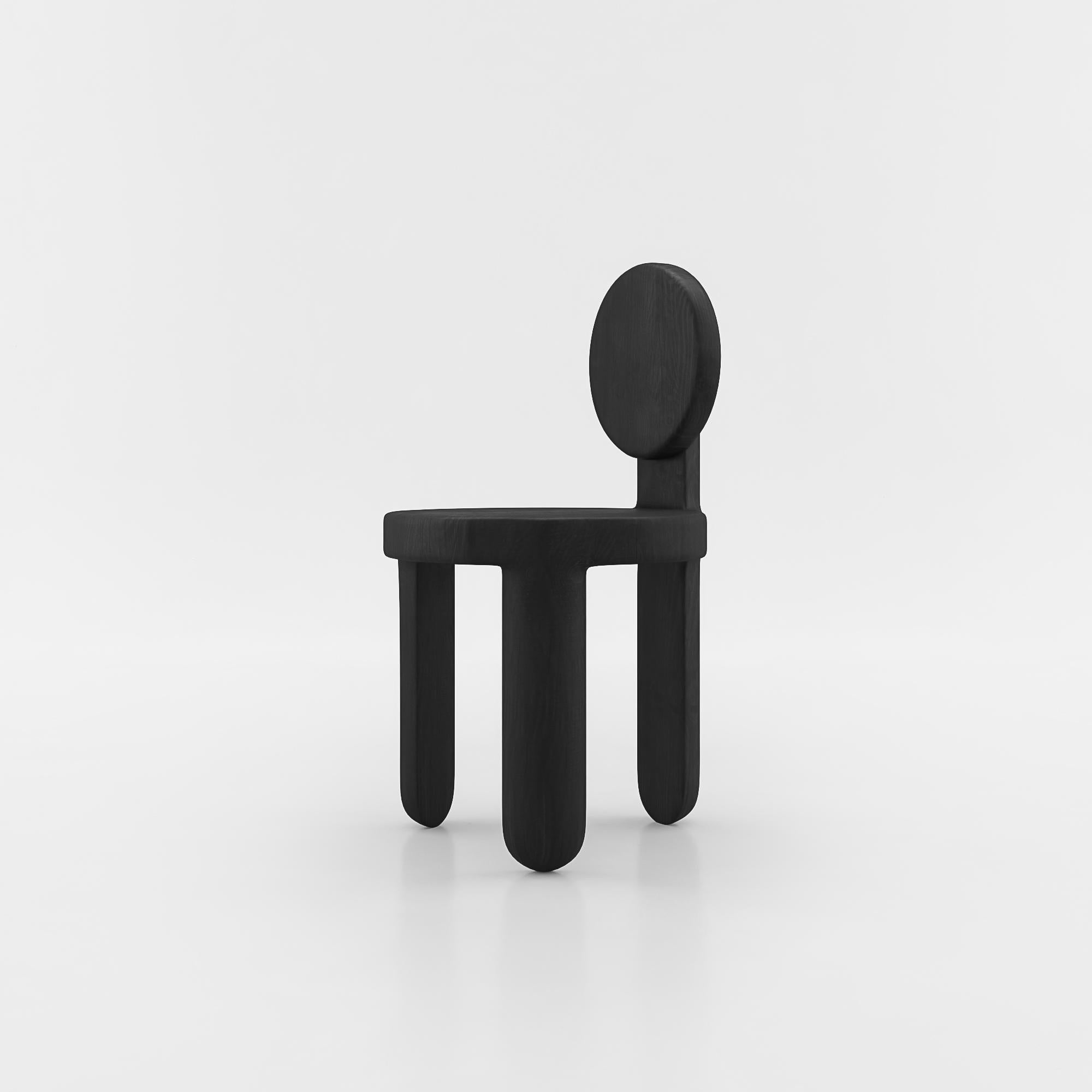 Three-legged chair by Vladimir Naumov
Dimensions: H 80 x W 45 x L 47 cm
Materials: Black oak

Vladimir Naumov is a professional architect, designer and artist.
While designing the furniture he tries to reach the perfect bled of forms and materials