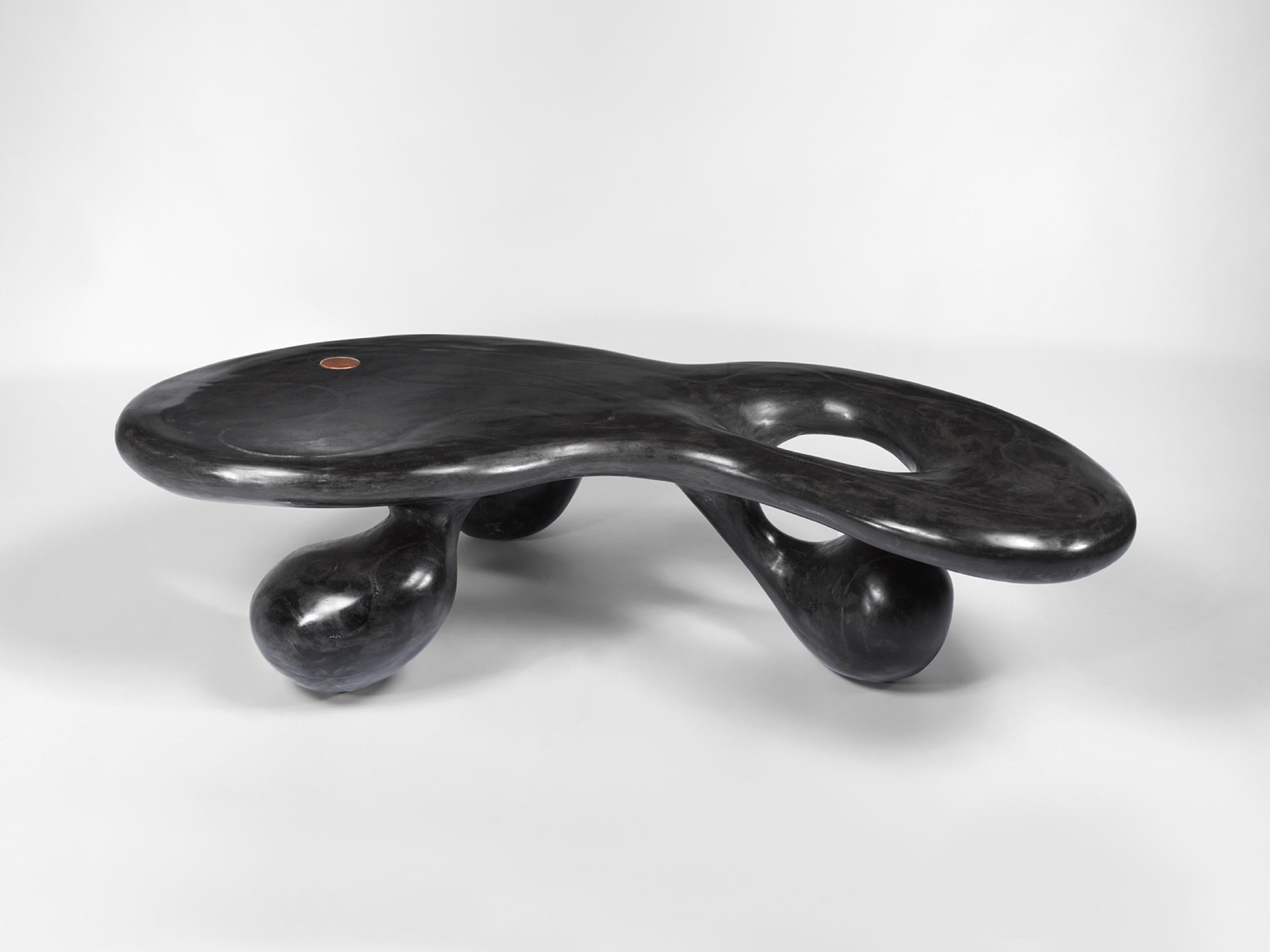 Three-legged coffee table. Black-tinted gypsum. Designed and made by Rogan Gregory, 2021, USA.