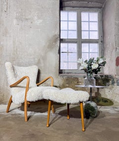 Three-legged, curved Stool - Scandinavian design  - Reupholstered Sheepskin