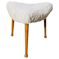 Three-legged, curved Stool - Scandinavian design  - Reupholstered Sheepskin