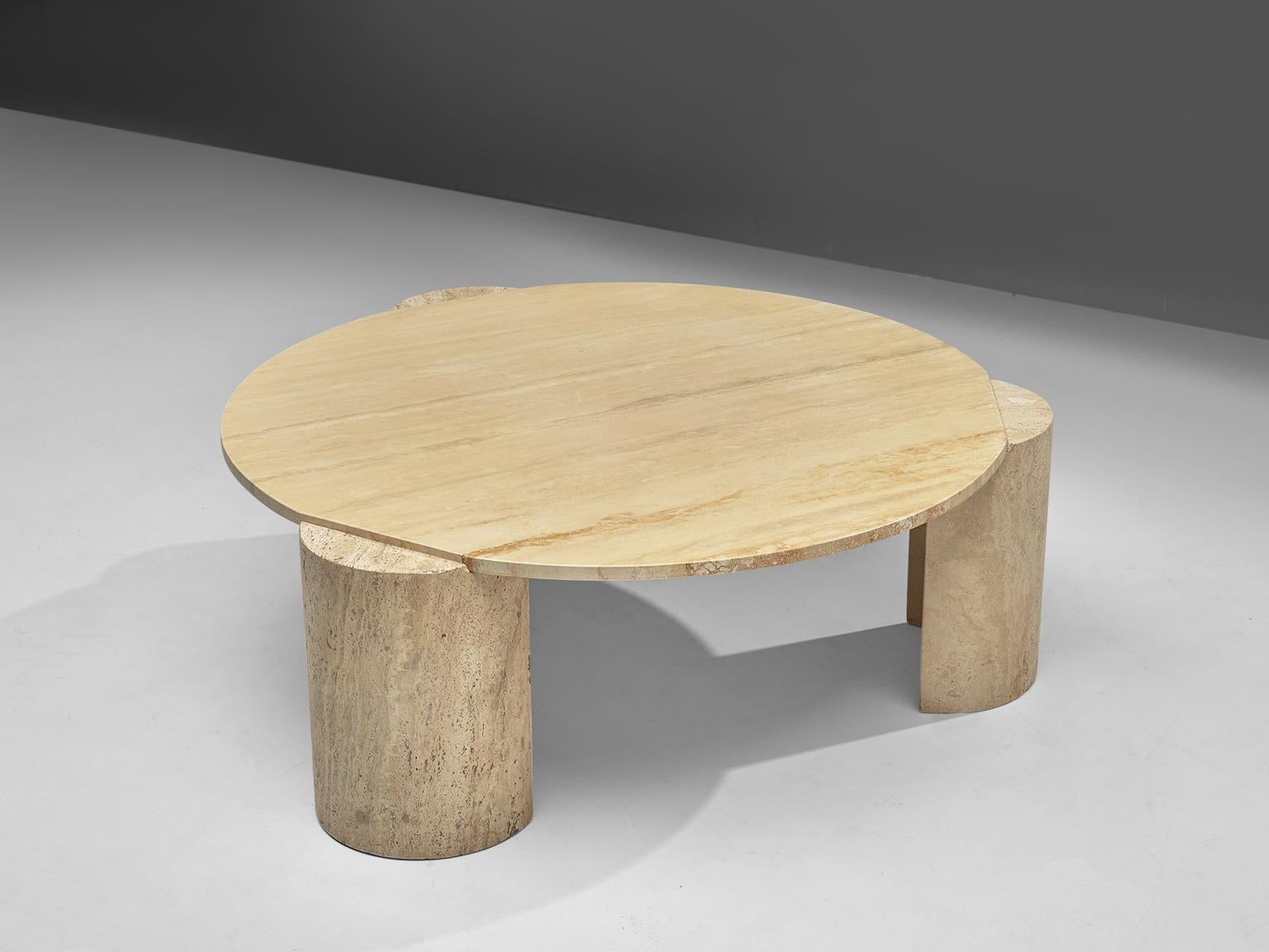 Round coffee table, travertine, Europe, 1970s.

This strong design coffee table features a round table top with a striking base. The three half-mooned shaped legs are placed slightly outwards the table top, which creates a nice visual effect. The