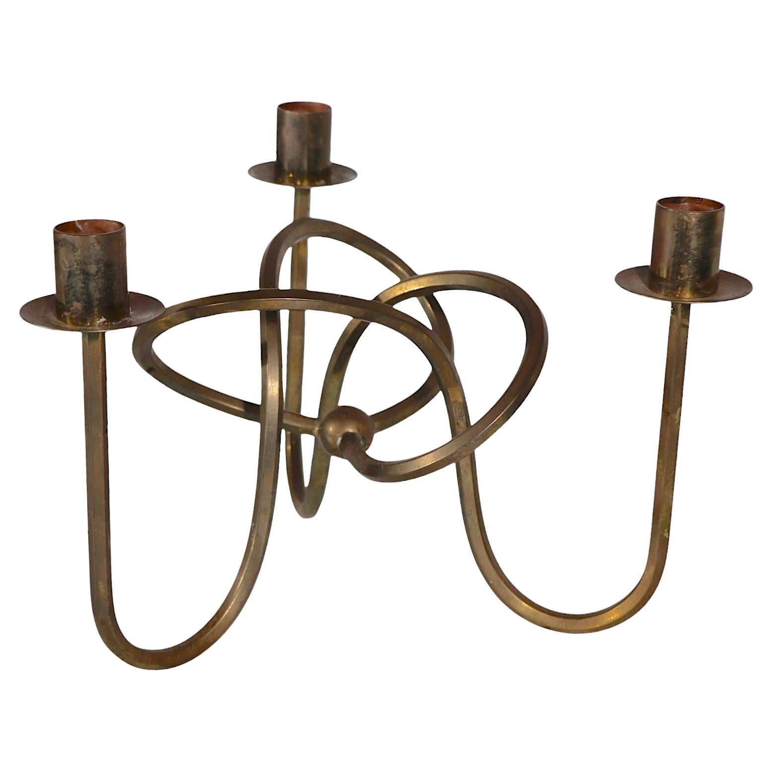 Iconic Scandinavian Modern design brass candlestick designed by Josef Frank for Svenskt Tenn, made in Sweden circa 1930's. Quintessential Northern European Modern, Art Deco period objet d'art. The candlestick, know as 