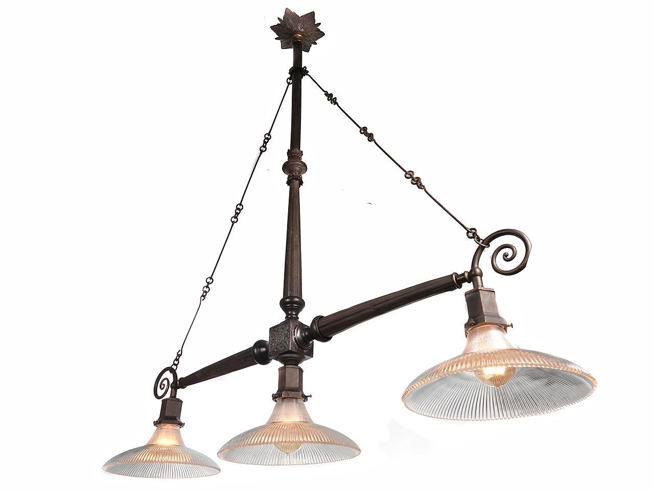 This was the type of double arm lamp found over store counters from the mid to late 1800. They were simple, utilitarian but still very stylish in detail. This example was refitted to now take standard bulbs. I has three 10 inch diameter prismatic