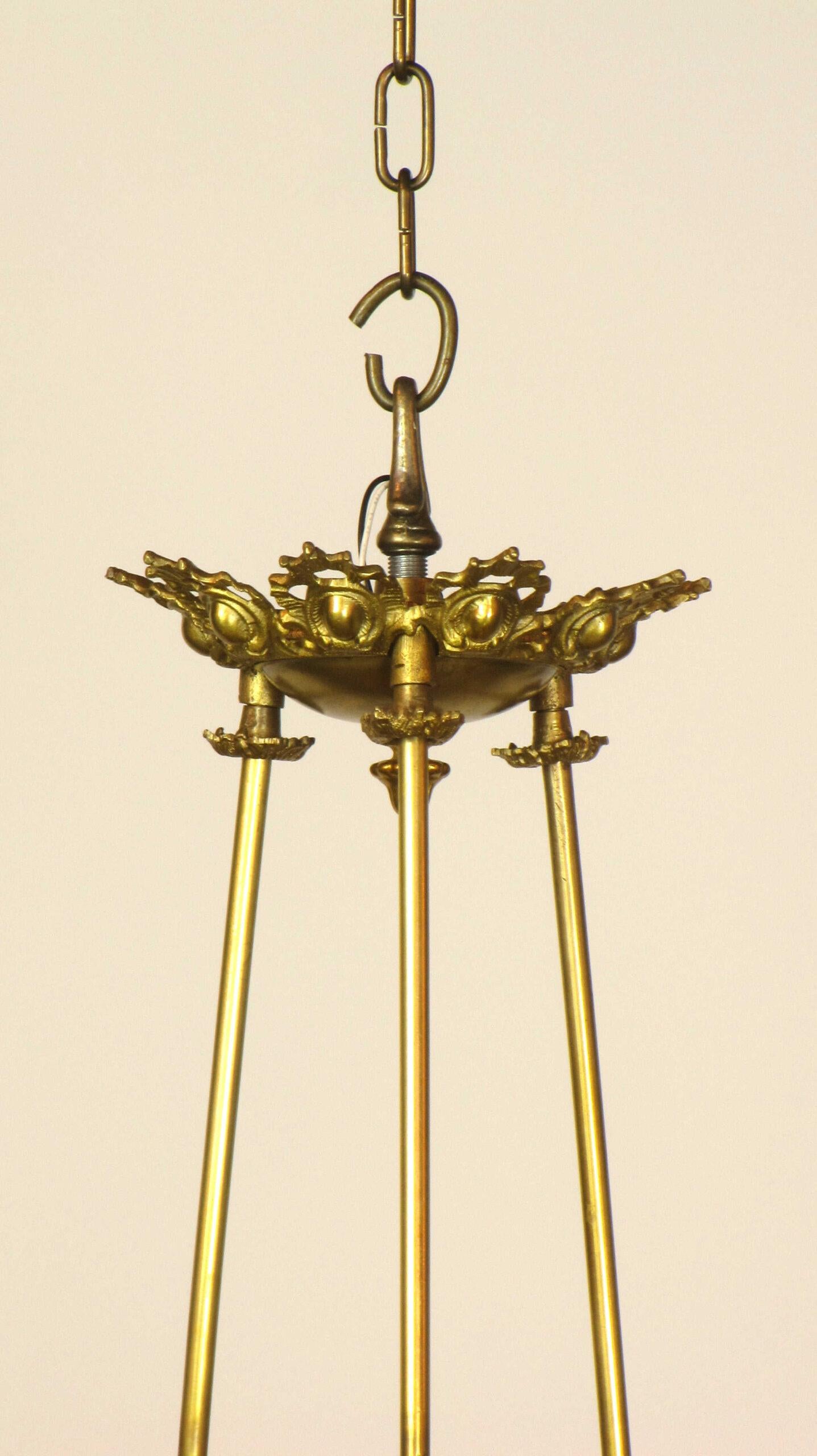 An early gas rod hung three light chandelier. The light is in the shape of a classical oil light, and detailed with cast brass serpents on each face.  C. 1850. Attributed to Cornelius and Baker.

Dimensions: 
Height: 36